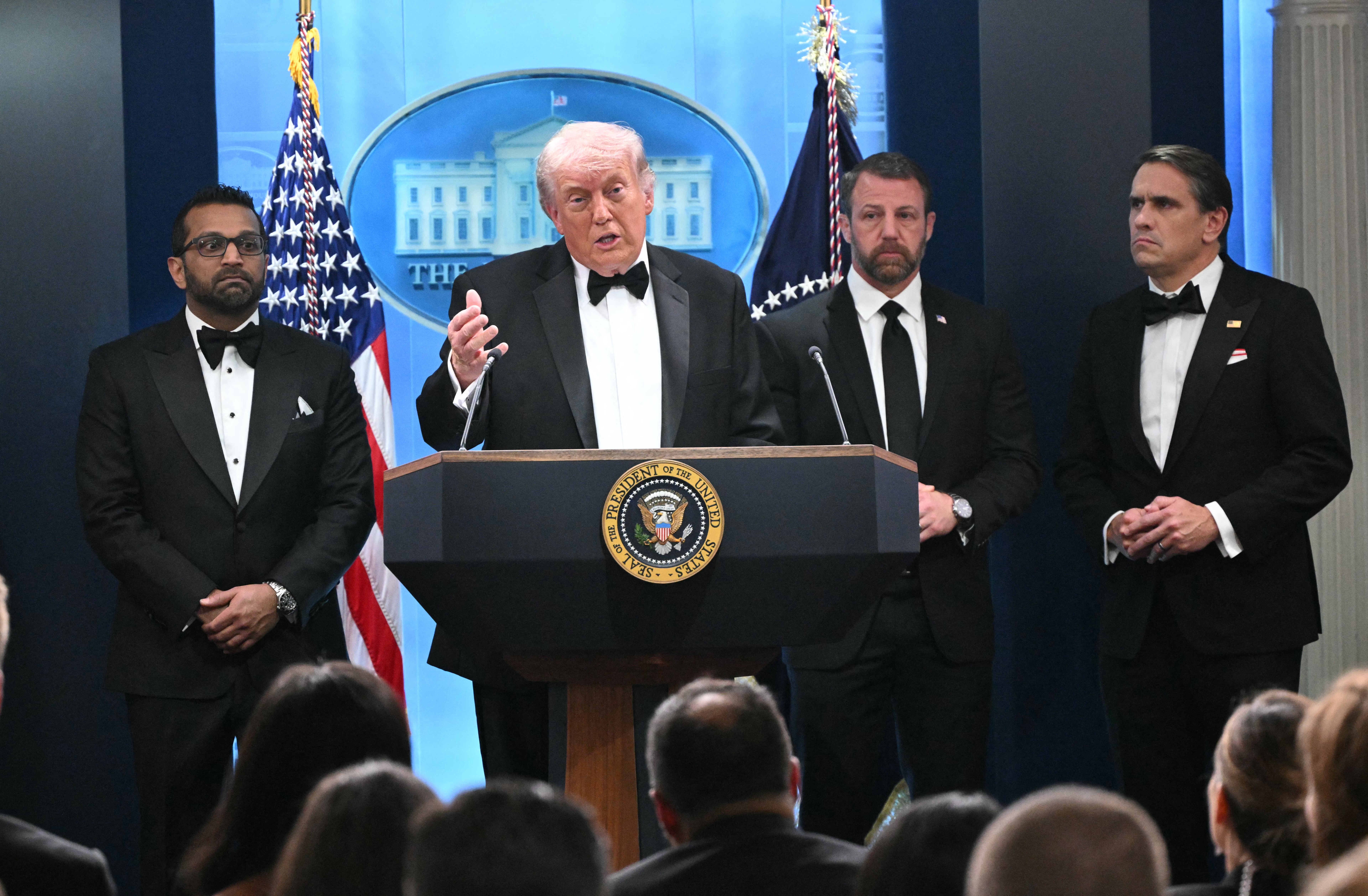 President Donald speaks, flanked by FBI Director Kash Patel, Secretary of Homeland Security Markwayne Mullin, and Acting Attorney General Todd Blanche, during a press briefing shortly after a shooting incident at the White House Correspondents' Dinner on April 25, 2026.