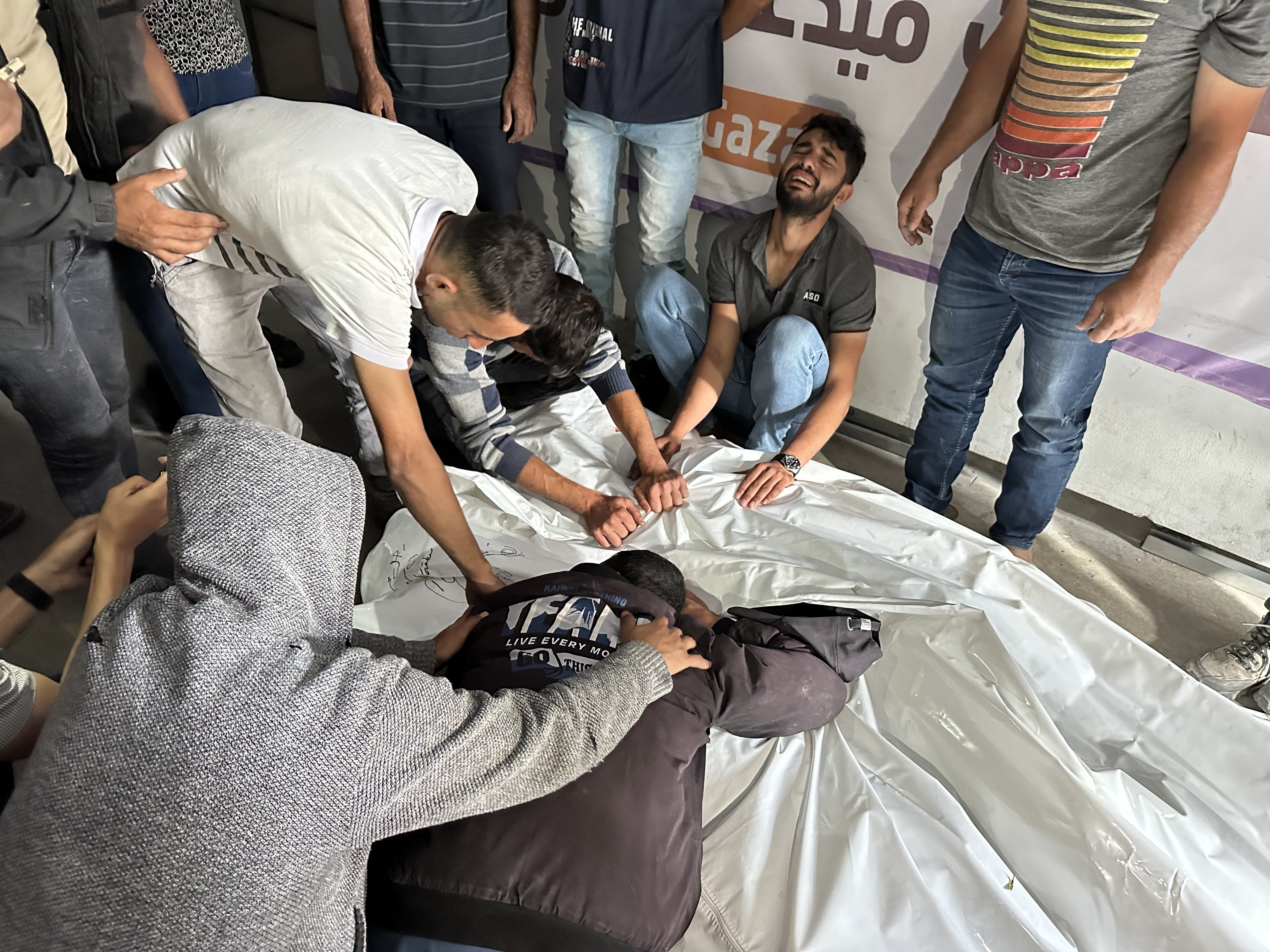 Palestinians grieve relatives who were killed in an Israeli airstrike on an encampment for displaced people on Sunday, May 26, in the southern Gaza city of Rafah. Gaza health officials say 35 people were killed in the strike.