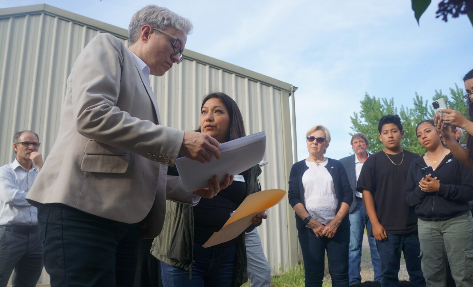 FILE - Gov. Tina Kotek on May 3, 2023 at the home of Ana Maria Rodriguez, a Boardman resident and Oregon Rural Action organizer, whose well water has nearly four times the safe drinking water limit for nitrate. Kotek was visiting with residents in Boardman, who are concerned that progress on the nitrate pollution in the Lower Umatilla Basin has been slow.