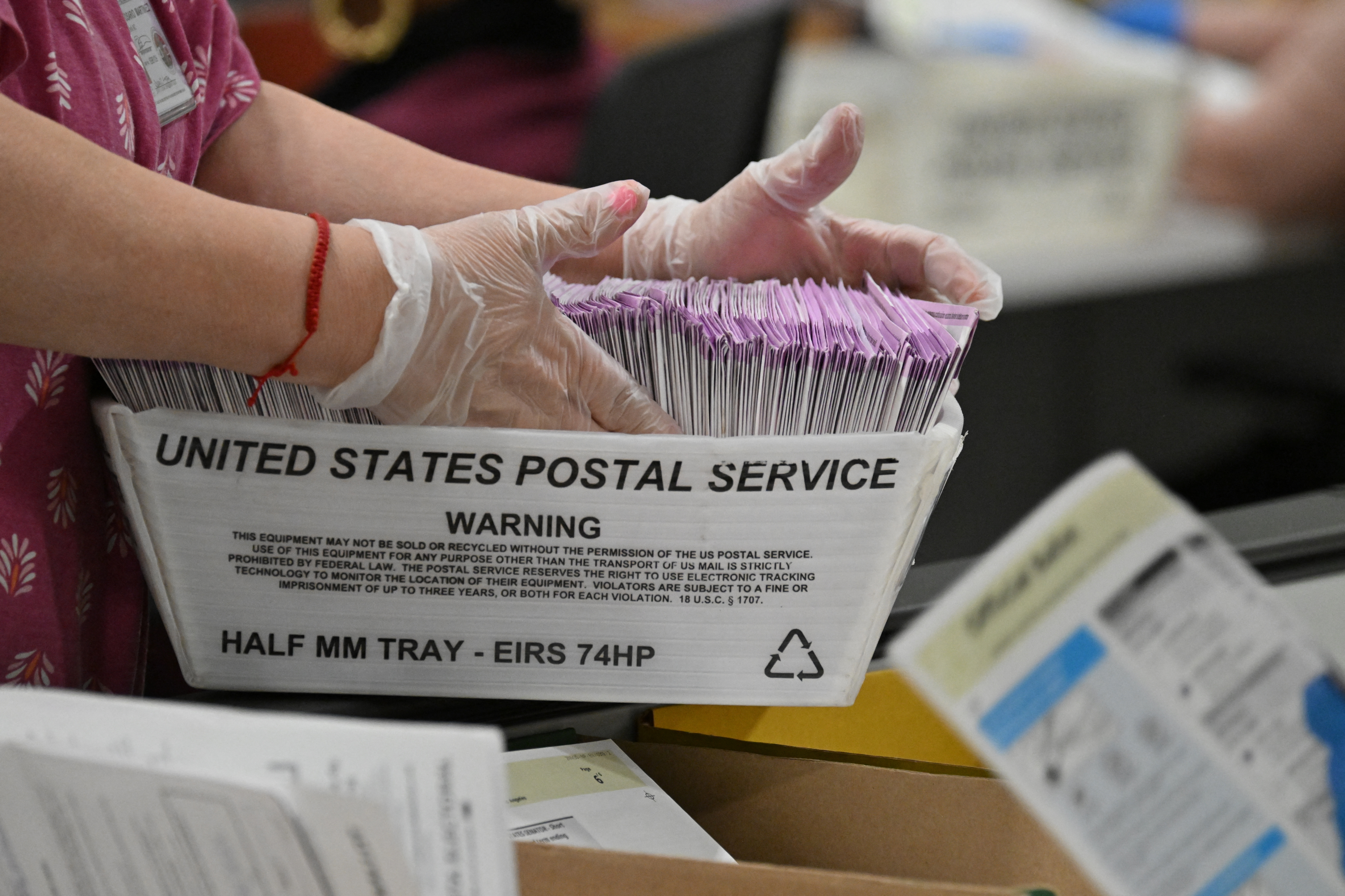 In this file photo, election workers prepare mail-in ballots for tallying at the Los Angeles County Ballot Processing Center on the eve of Election Day, November 4, 2024, in City of Industry, California.