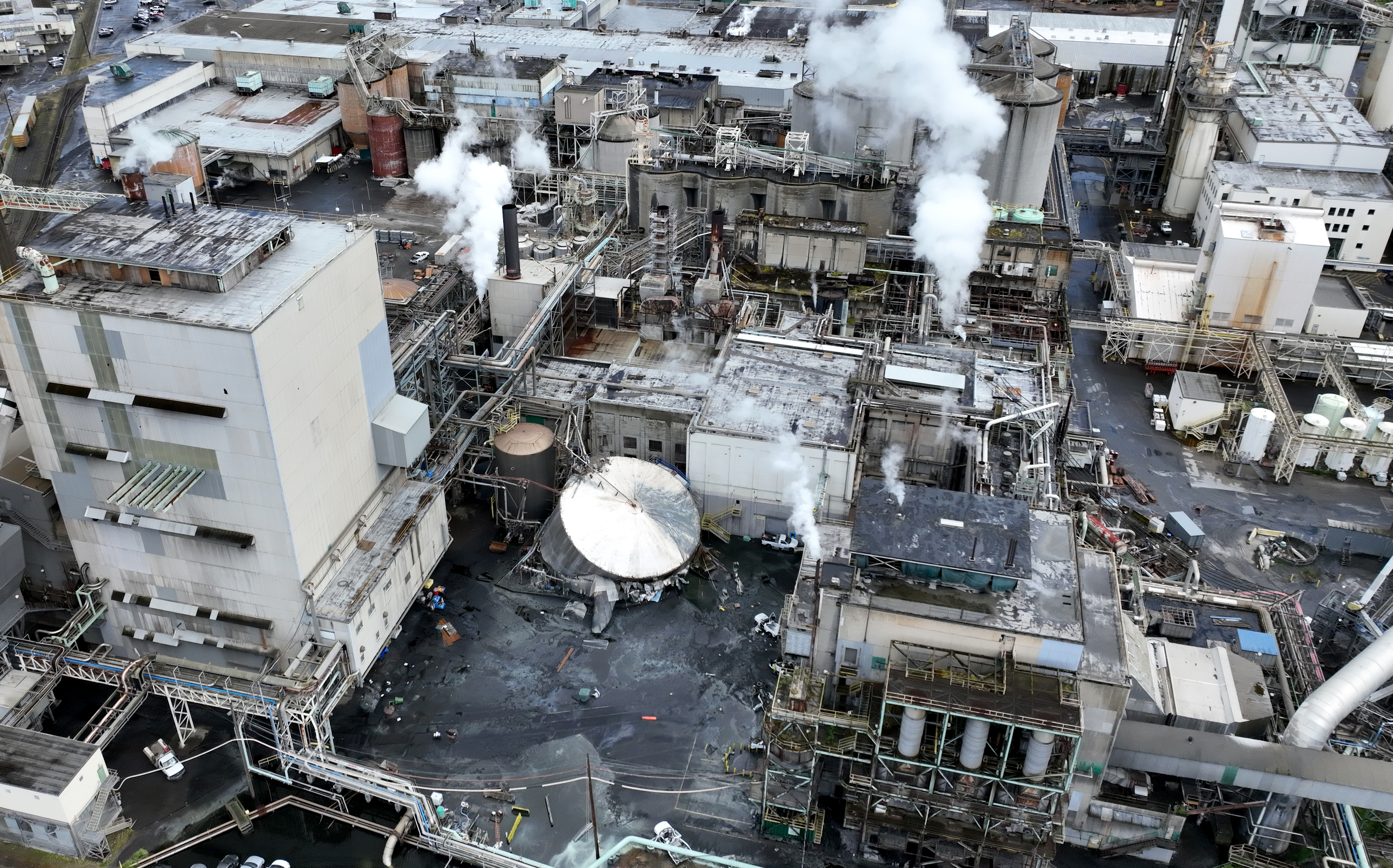 FILE -- Aerial views of the Nippon Dynawave Packaging Co. in Longview, Wash., showing the scene of a major chemical tank implosion at a Southwest Washington paper mill, May 26, 2026.