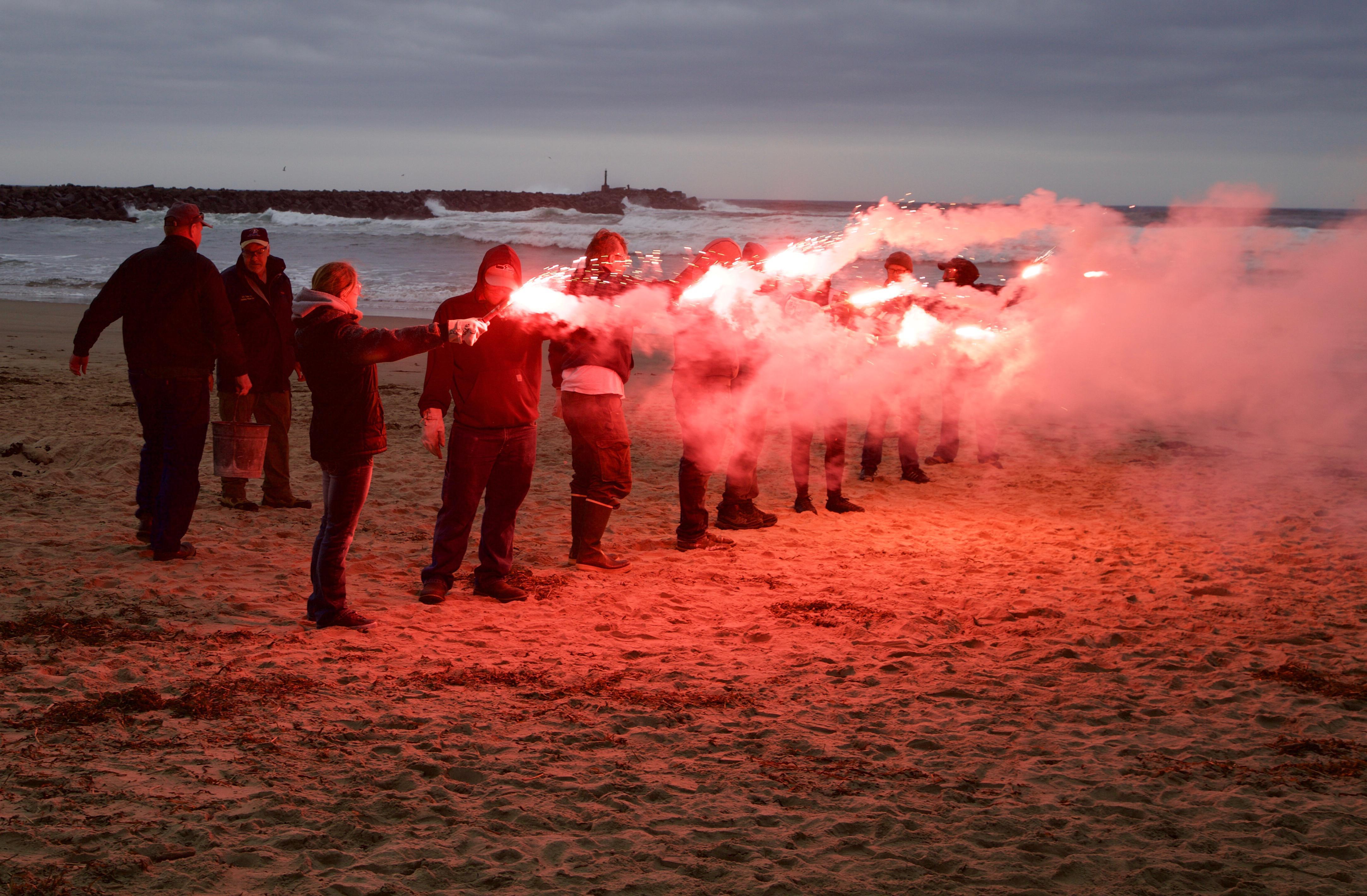Fishery workers were shown how to operate flares and smoke canisters so they can be seen in an emergency