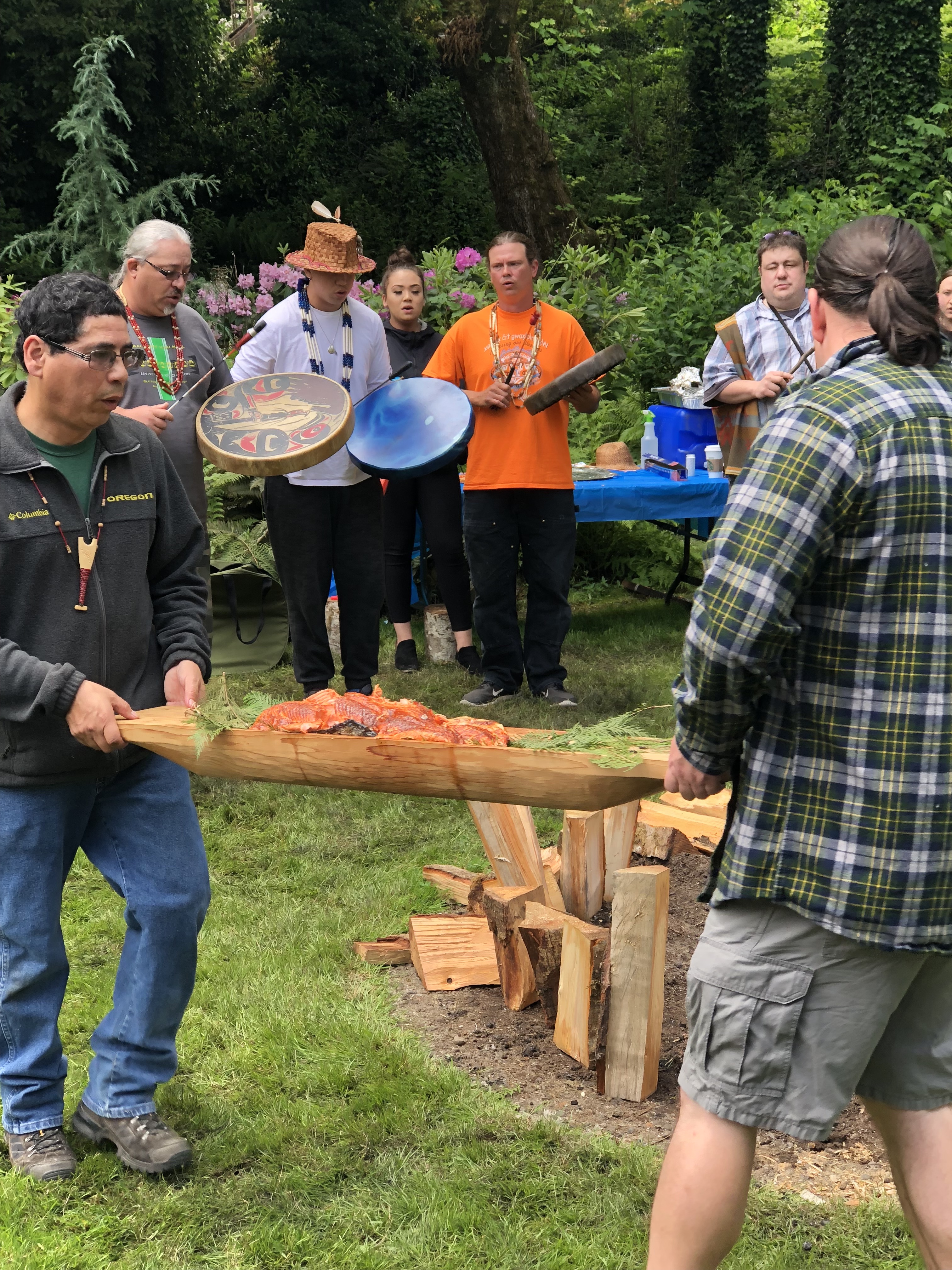Members of the Confederated Tribes of Grand Ronde hold a first foods ceremony with a traditionally harvested salmon.