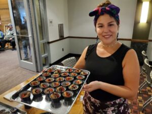 Syreeta Azure holds a tray of ‘eel pate.’