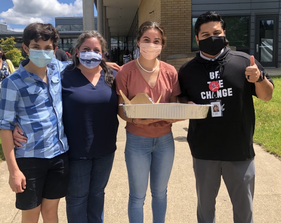 In this photo, shared by Shannon McArthur, CHS principal Nate Muñoz (far right) poses with Prisca Diaz and her children Regina and Emiliano on Friday, May 28, 2021.