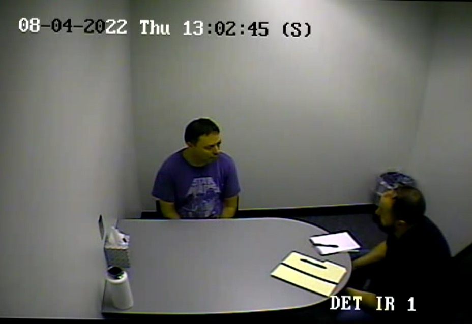 Security camera footage shows Christopher Knipe being questioned by Portland police detective Scott Broughton. Knipe was charged with Sean Kealiher's murder and is being held without bail.