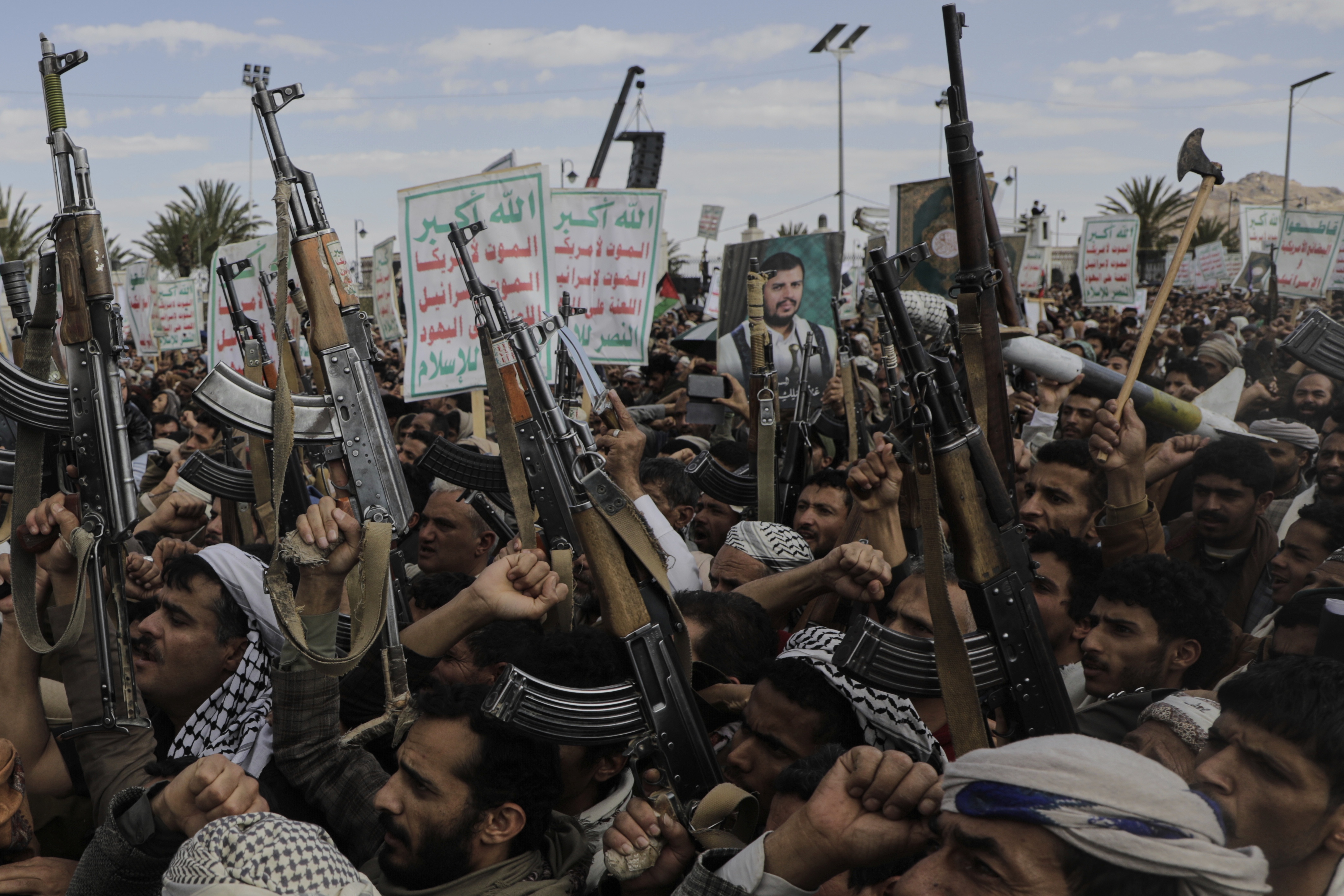 Houthi supporters chant slogans and hold pictures of Abdul Malik al-Houthi, the leader of the Houthi movement, during an anti-U.S. and anti-Israel rally in Sanaa, Yemen, Monday, March 17, 2025.