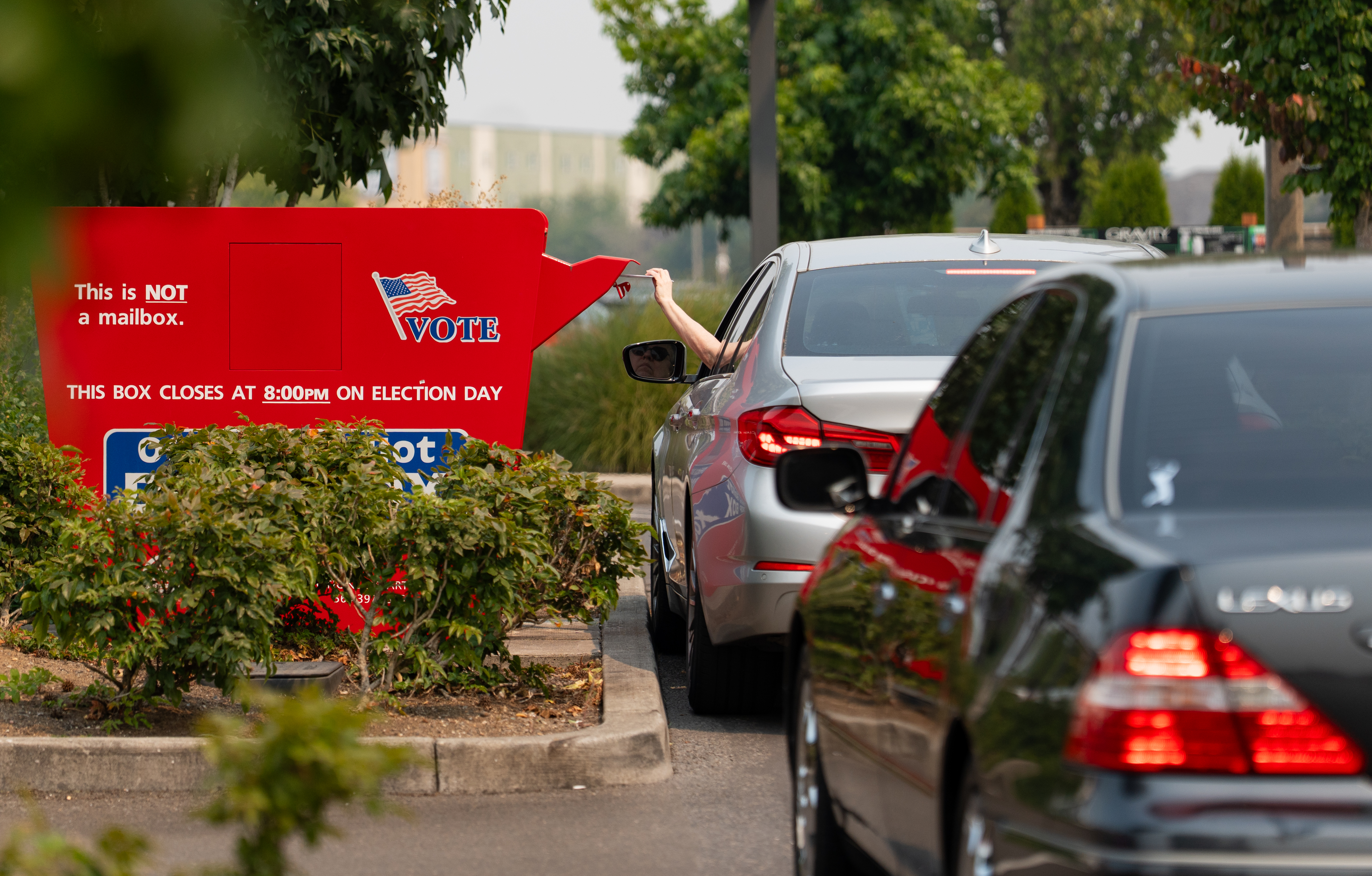 Voters drop off ballots in a ballot box at Vancouver Mall in Vancouver, Wash. on Aug. 4, 2026.