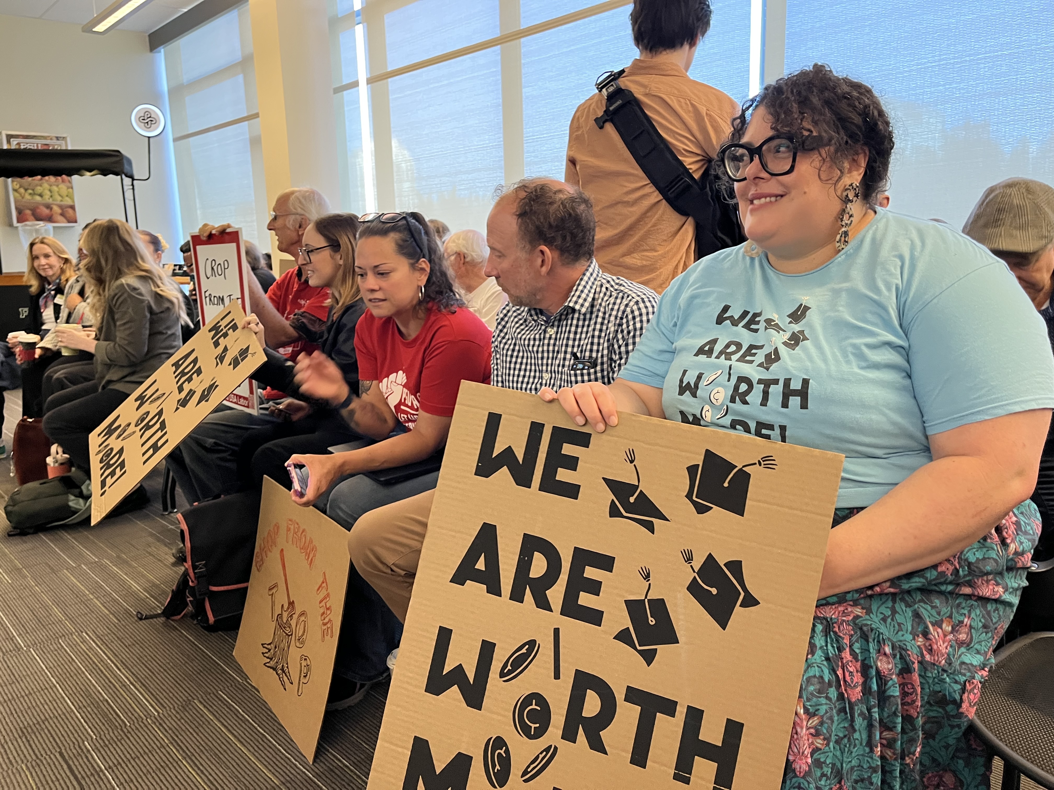 Portland State University faculty wait voice their opinion on a new financial sustainability plan at the September 26, 2025 board of trustees meeting in downtown Portland.