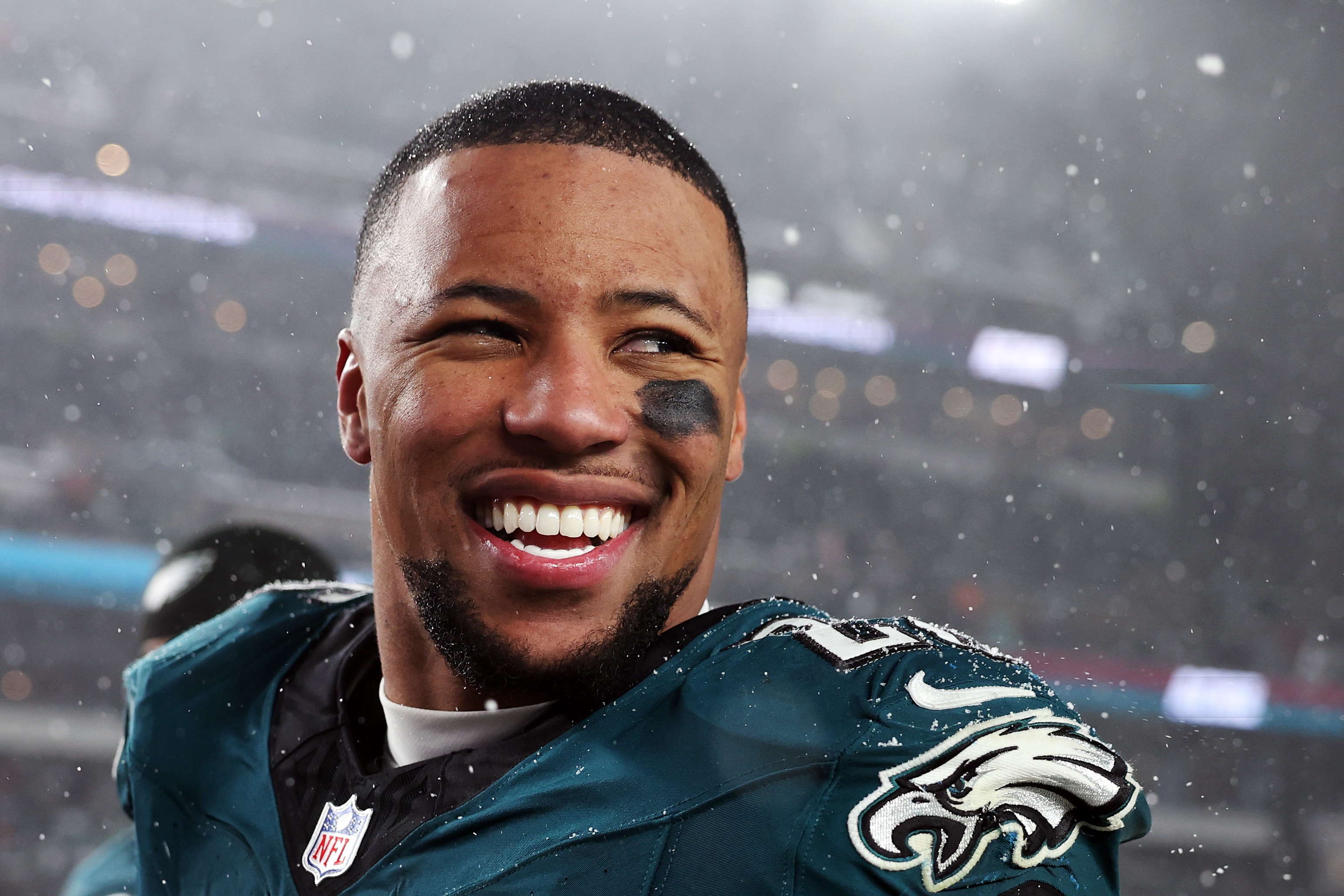 Saquon Barkley #26 of the Philadelphia Eagles smiles during the NFC Divisional Playoff game against the Los Angeles Rams at Lincoln Financial Field on January 19, 2025 in Philadelphia, Pennsylvania.