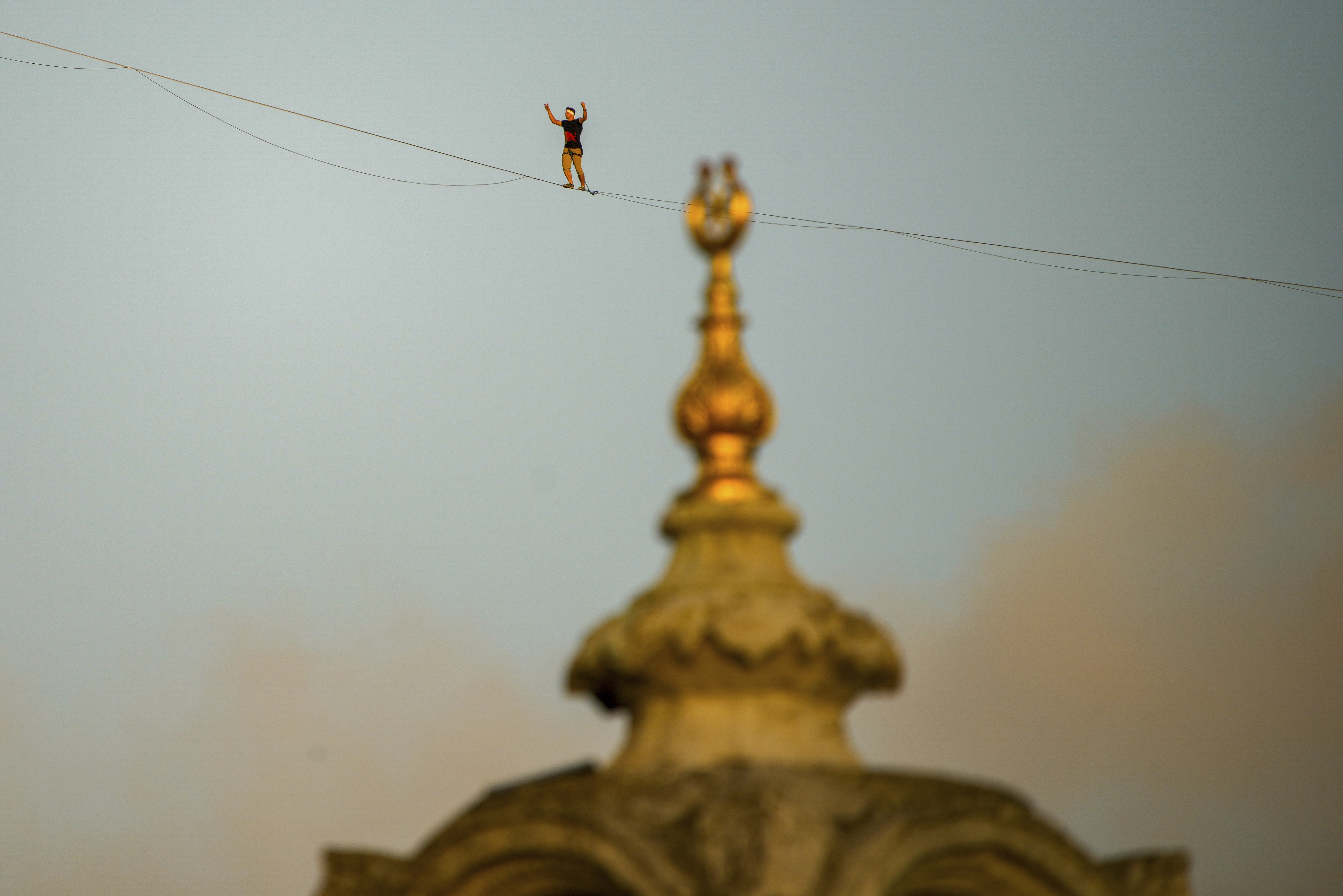 FILE - A slackliner on a tightrope in Istanbul, Turkey in 2024. The little-known extreme sport, also called highlining, has grown in popularity, including in the U.S. On Jan. 2, 2026, four Oregonians died after the helicopter they were in likely collided with a slackline strung across a canyon in Arizona, according to local authorities. The NTSB is investigating.