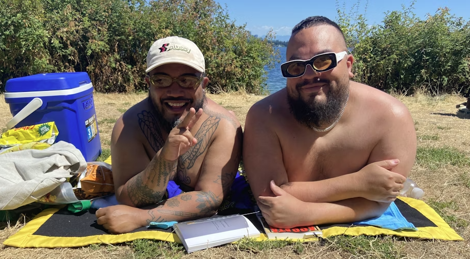 Derek Dizon, left, and Erik Rios, right, came to Denny Blaine Park in Seattle on July 15, 2025, to cool off and relax.