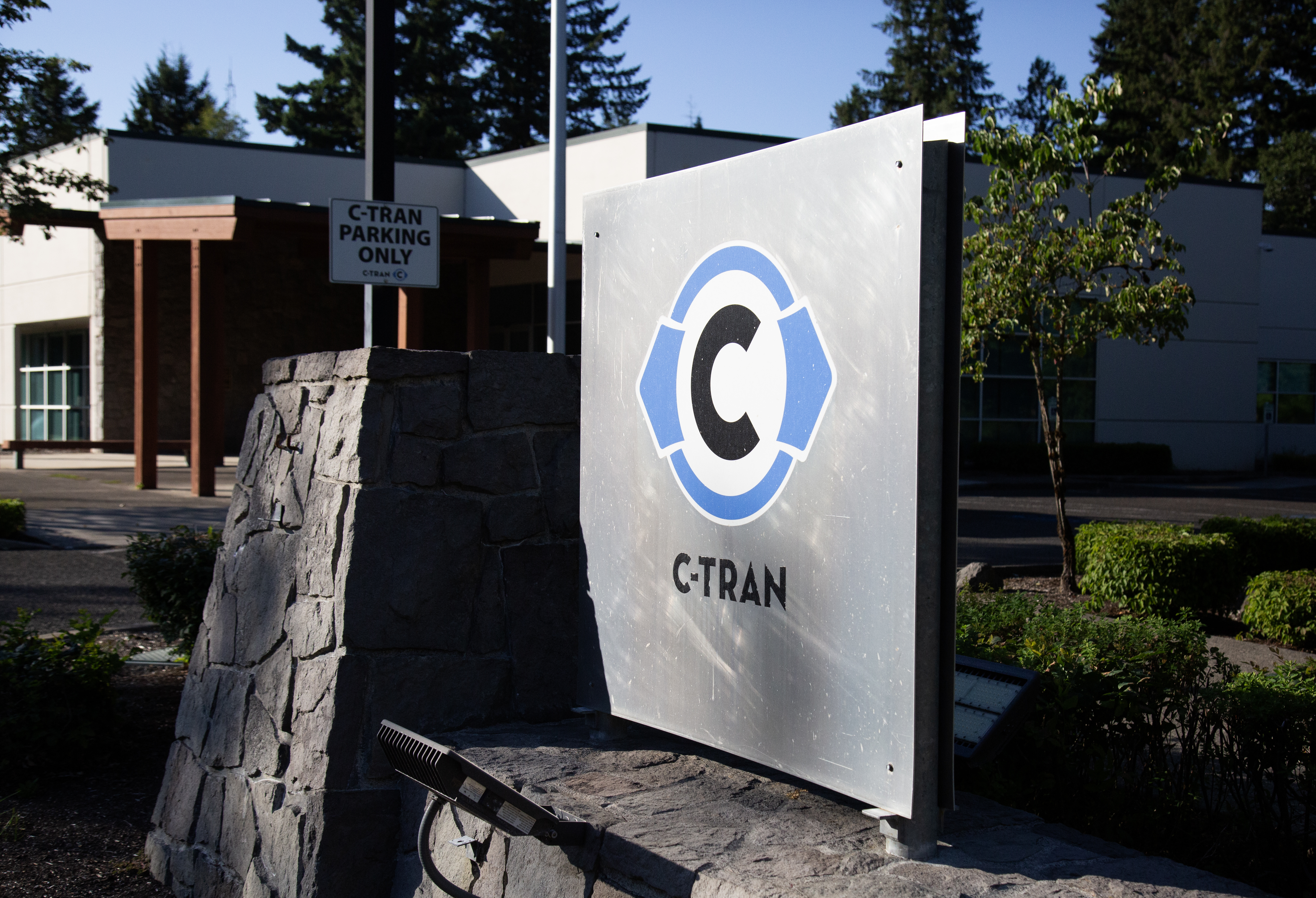 A sign outside of an office building with a Clark Transit logo