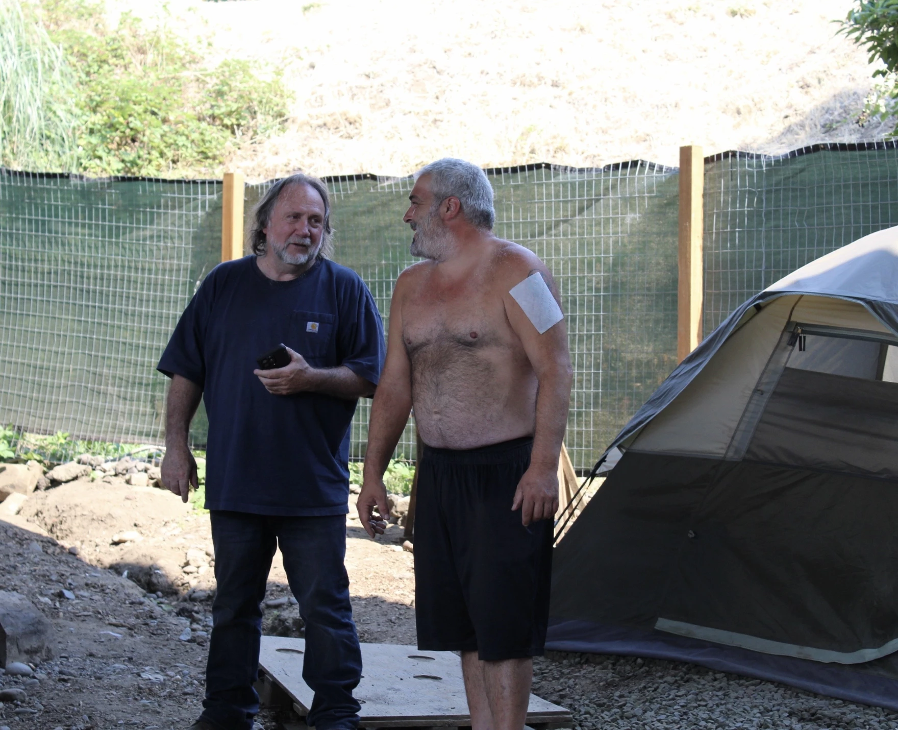 Bernie Woodard, left, operations manager at Elk Island Trading Group, with one of his camp leaders, Bear, on July 16, 2025.