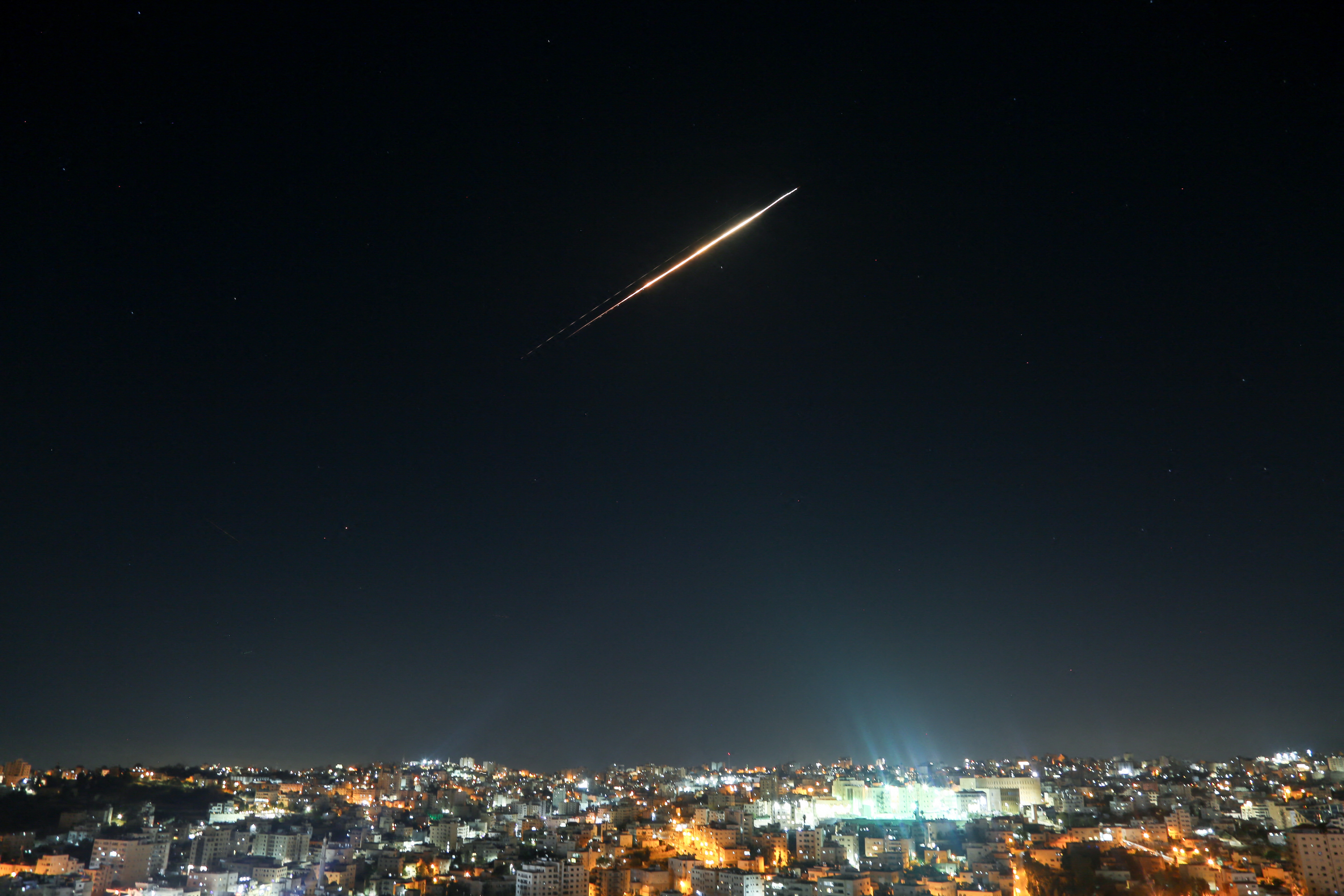 Iranian missiles aimed at targets in Israel pass through the sky of Hebron, West Bank on June 18 as Israeli air defense system tries to intercept them.