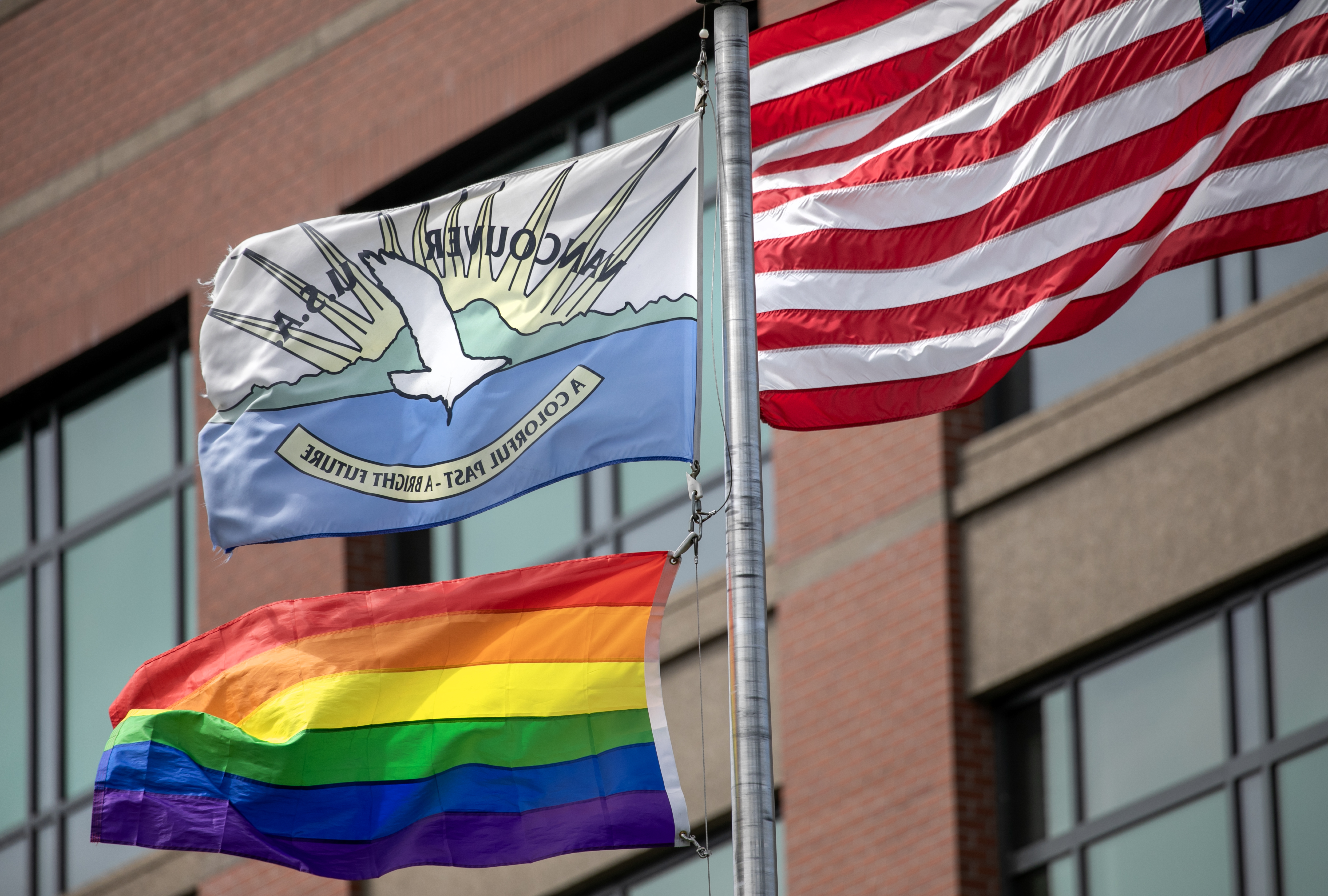 FiLE - Vancouver's old city flag flies outside of Vancouver City Hall, in Vancouver, Wash., June 29, 2024. 