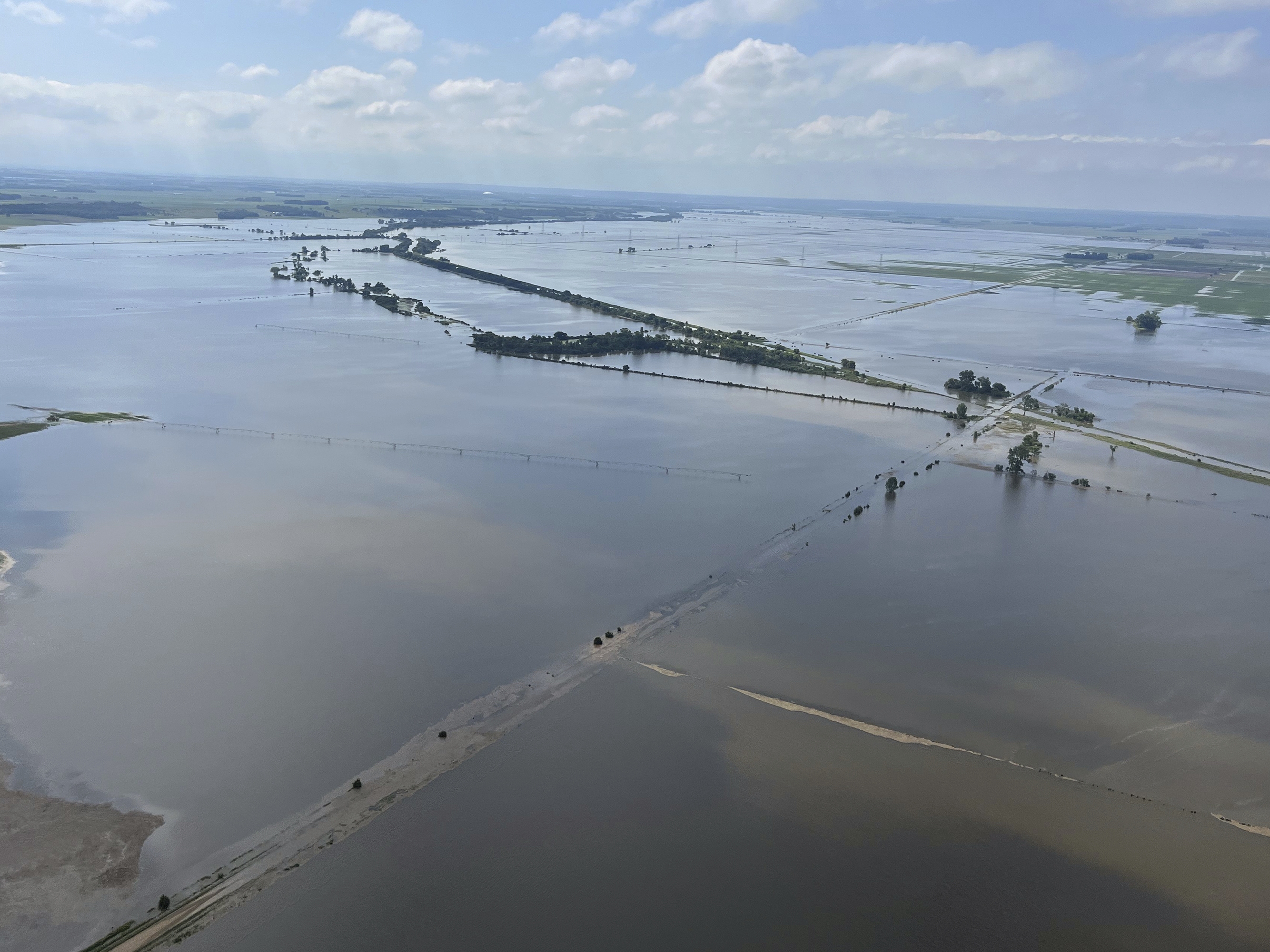 Heavy rains in recent days have submerged farmland near Vermillion, S.D., on Tuesday. Flooding has devastated communities in several states across the Midwest.