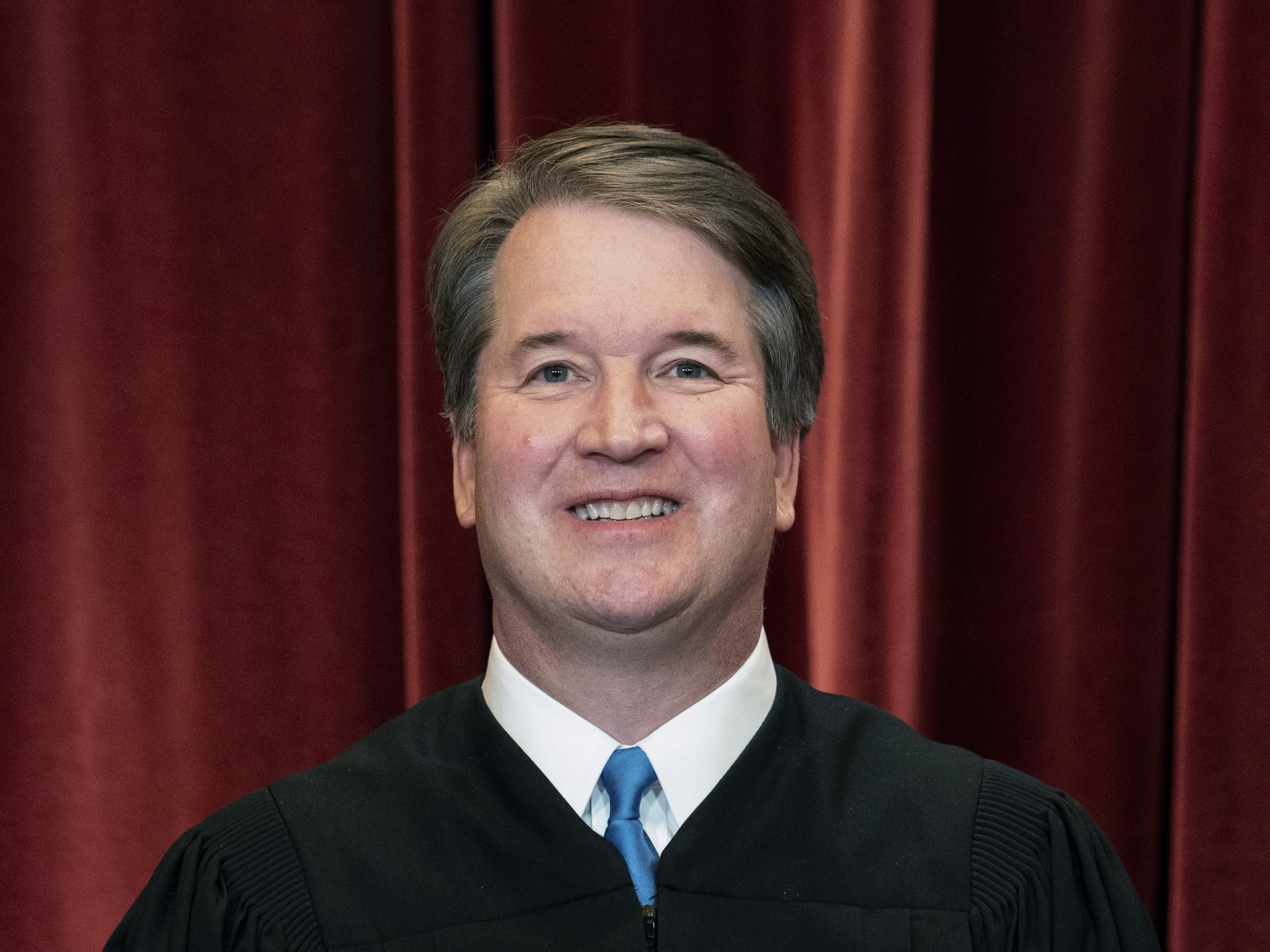 Associate Justice Brett Kavanaugh stands during a group photo at the Supreme Court in Washington last year.