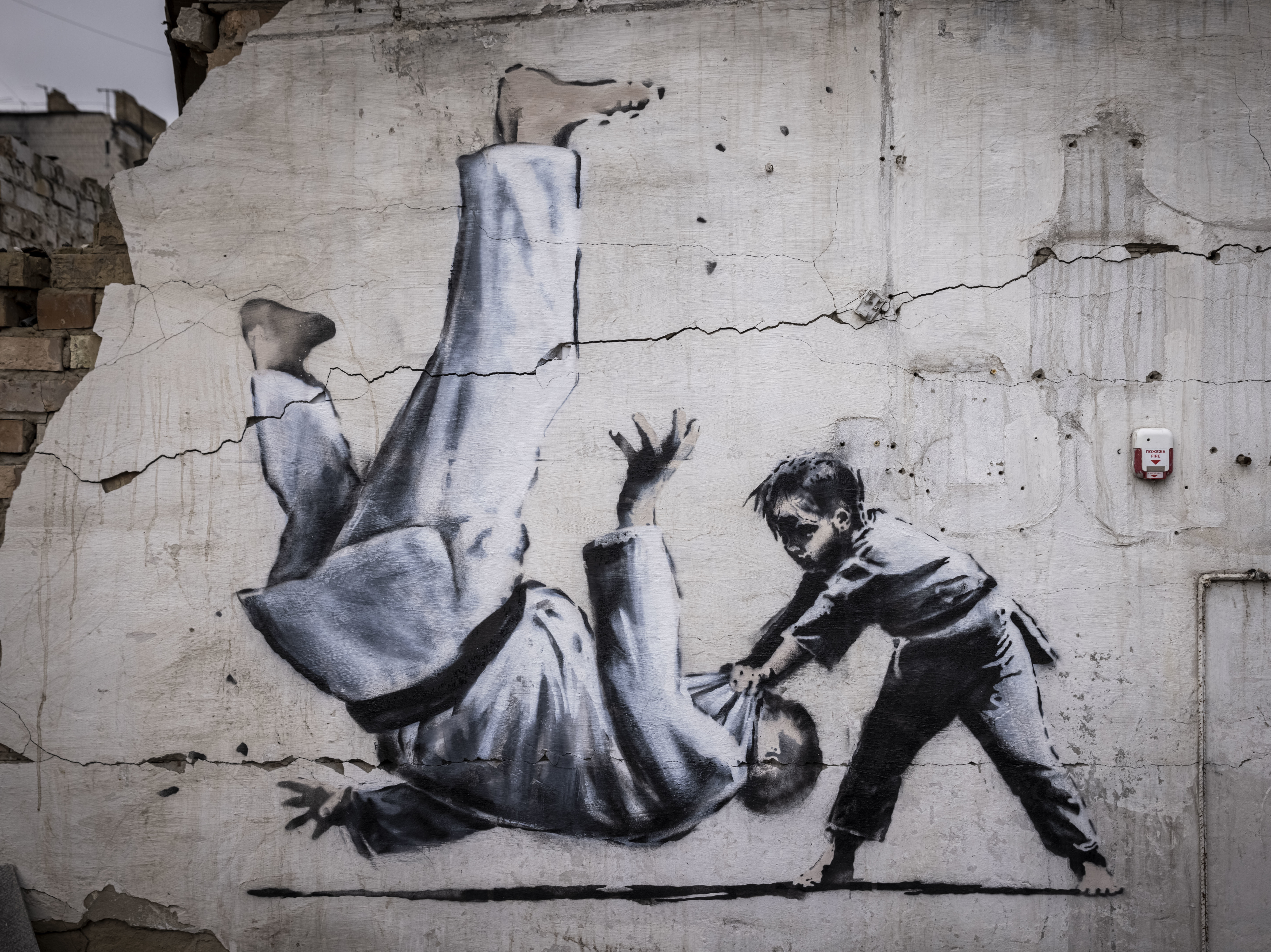 A new Banksy mural adorns a destroyed building in Ukraine - OPB