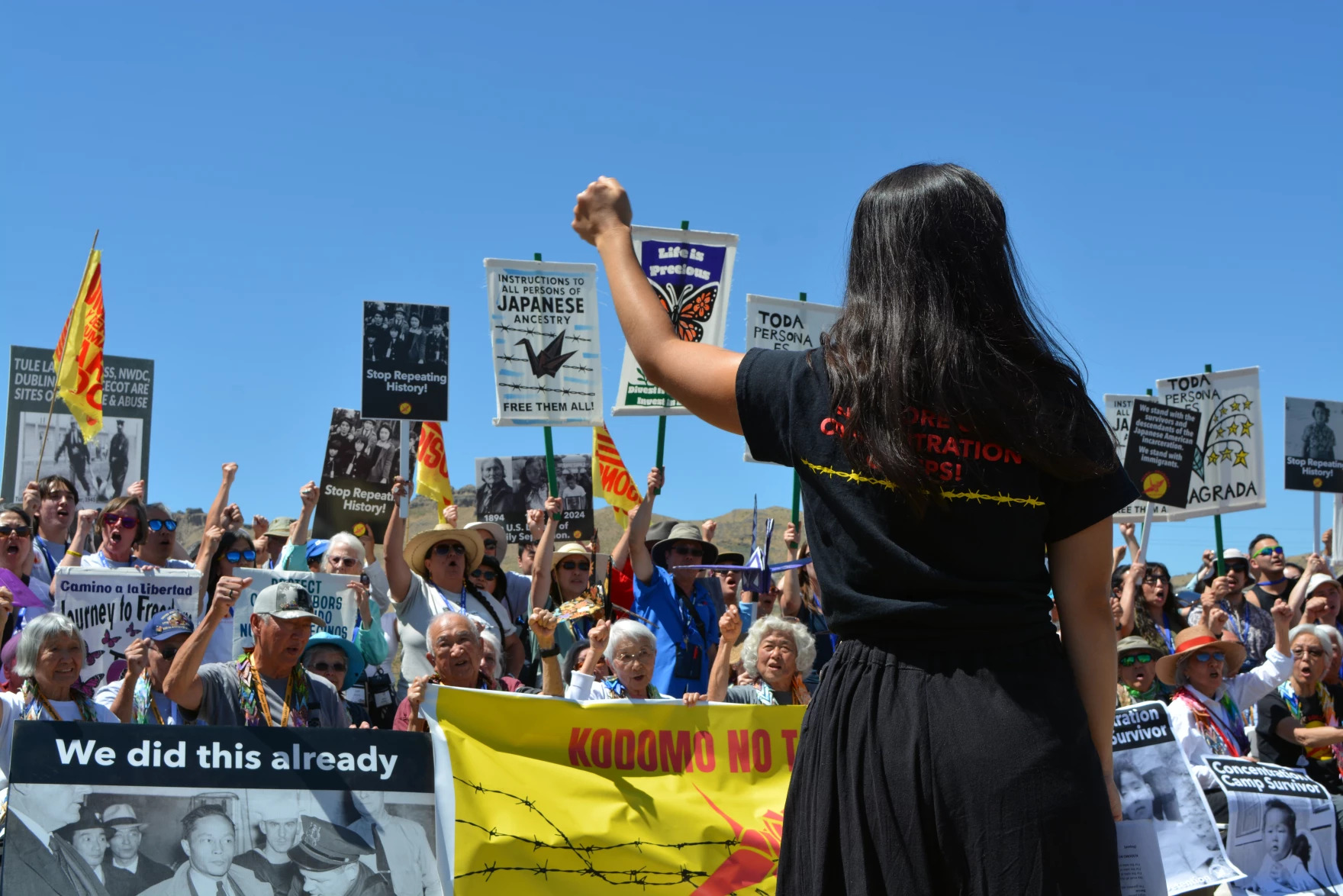 Members of the Tule Lake pilgrimage, including survivors of the incarceration camp, protest the conditions in modern-day immigrant detention facilities, July 4, 2026.