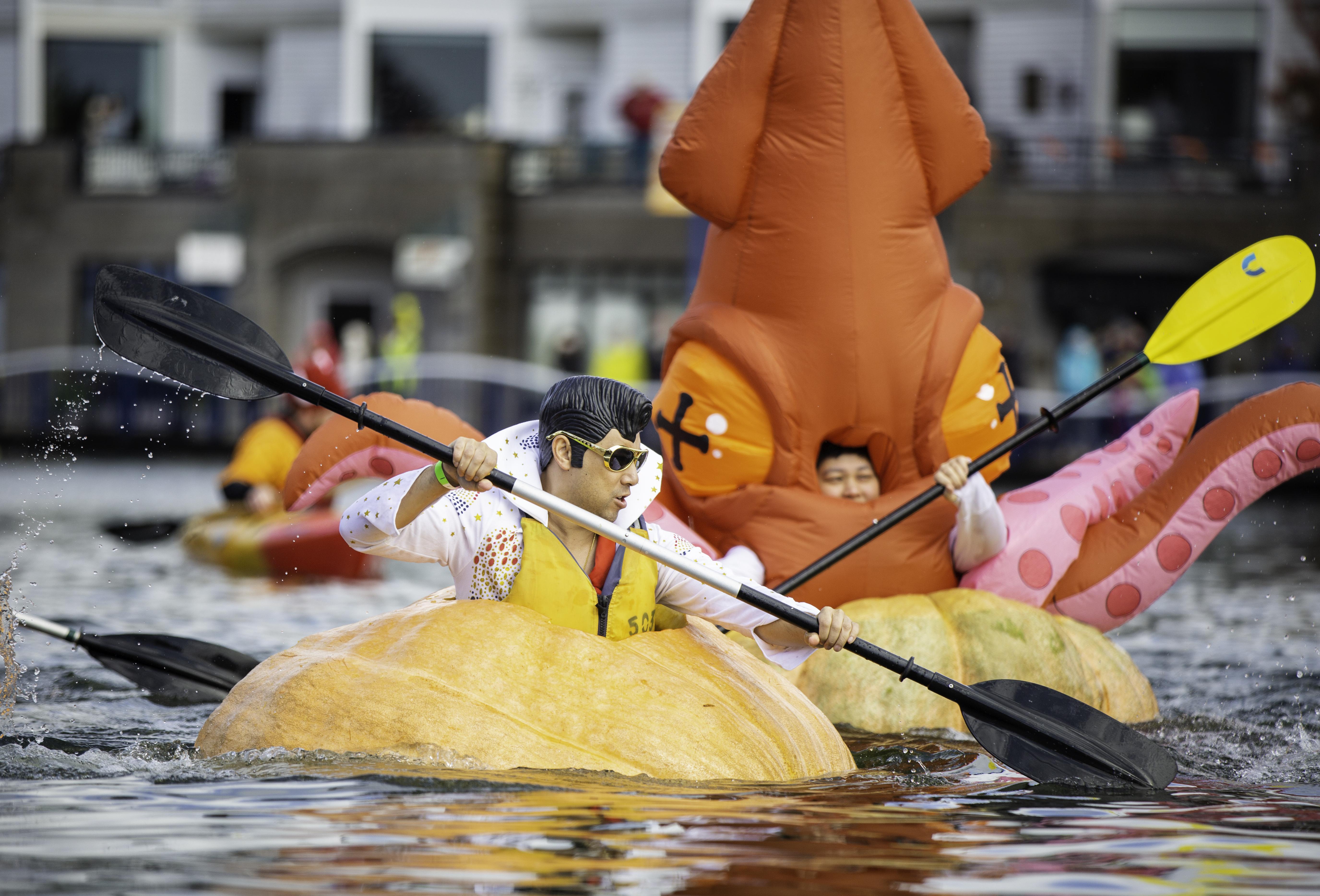 Pumpkin paddlers dressed in a variety of costumes at the West Coast Giant Pumpkin Regatta.