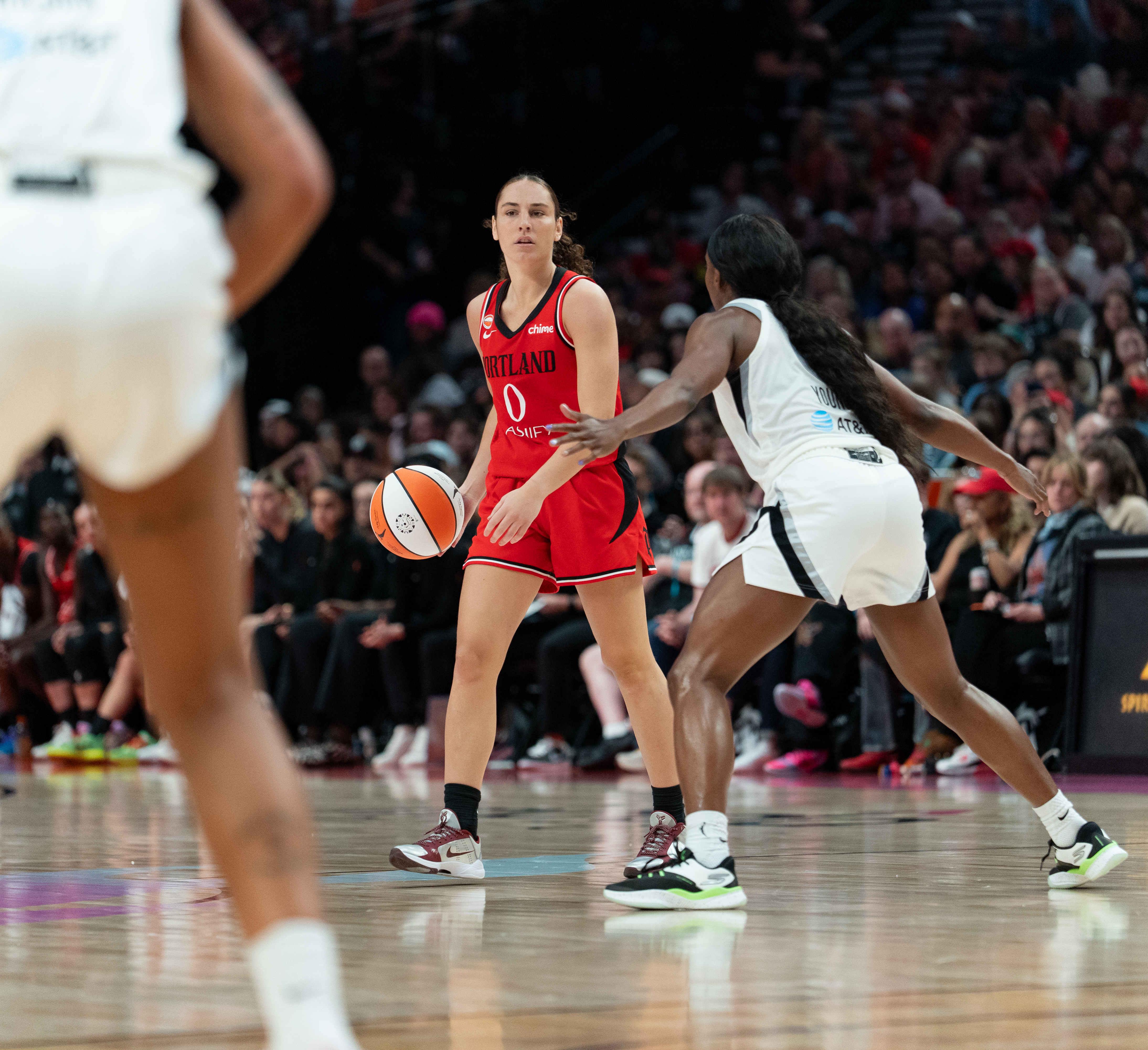 FILE — Portland Fire guard Carla Leite (0) dribbles the ball as Las Vegas Aces guard Jackie Young (0) puts her arms up to block at the Moda Center in Portland, Ore., on July 9, 2026. The Portland Fire played the Las Vegas Aces, loosing 88-80.