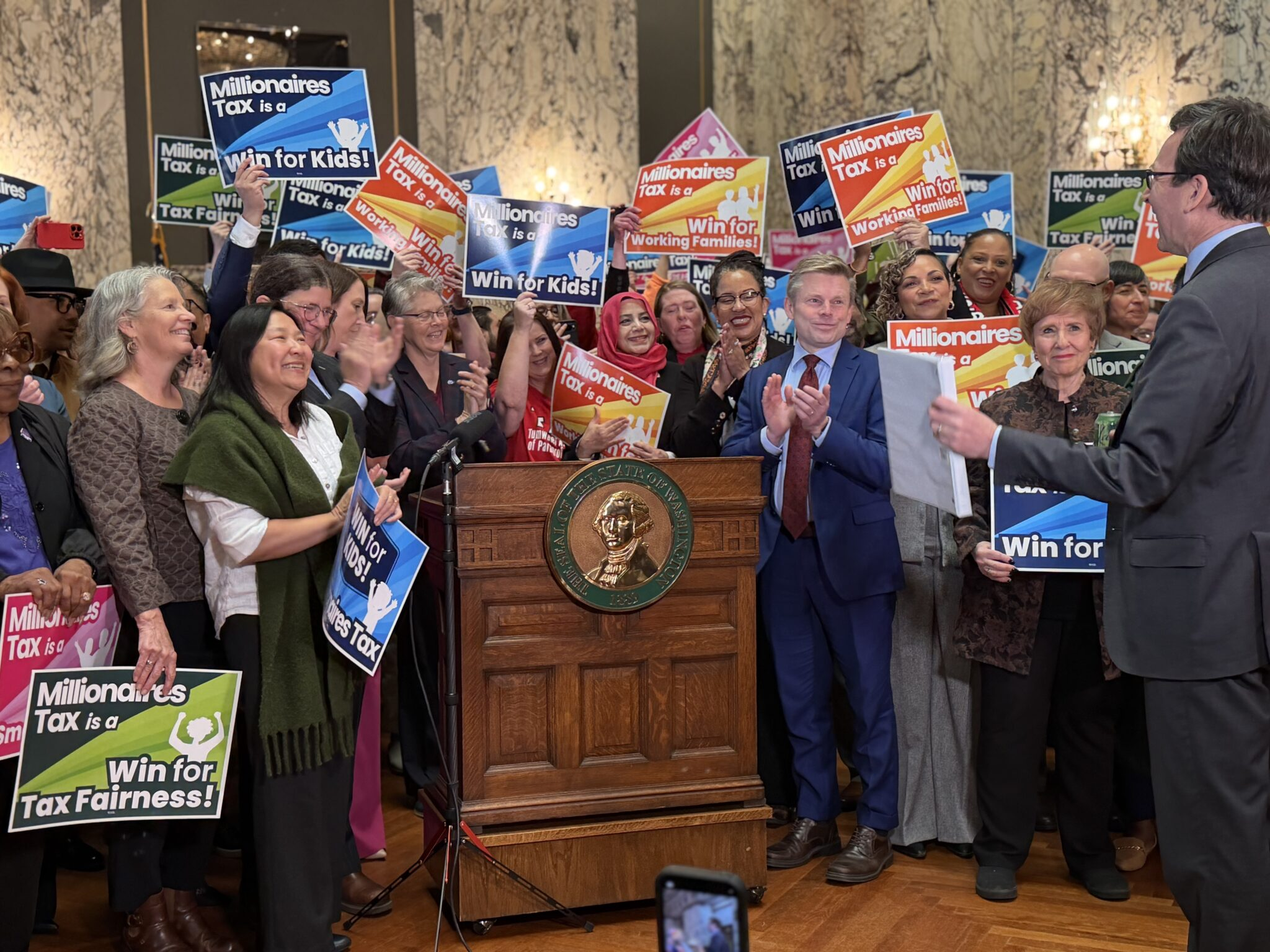 Income tax signed in Washington with a legal challenge close behind - OPB