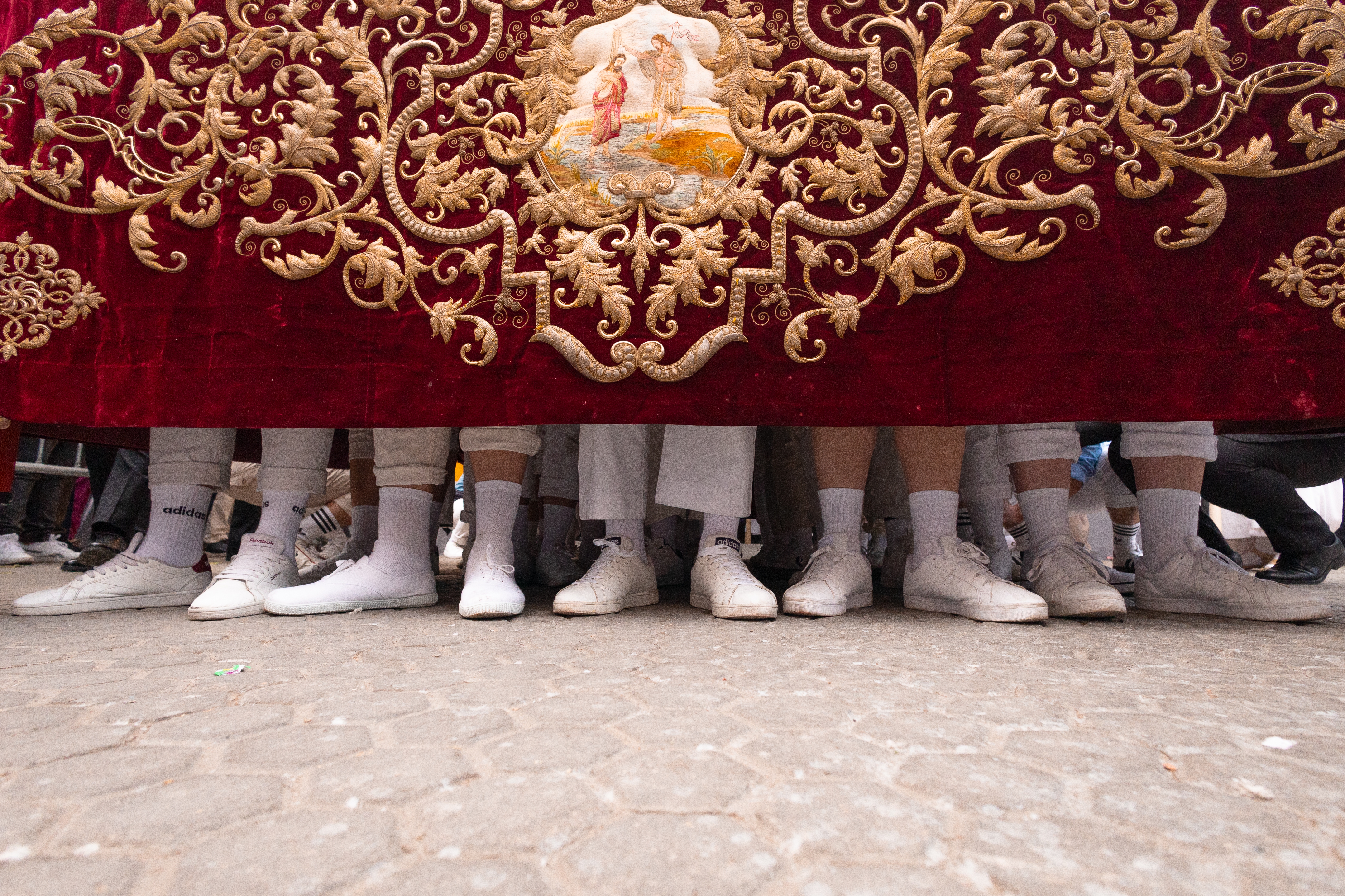 Costaleros (men who carry floats bearing the statue of Christ or the Virgin) from la Hermandad de la Amargura (Brotherhood of La Amargura) procesion during holy week on March 29, 2026 in Seville, Spain.