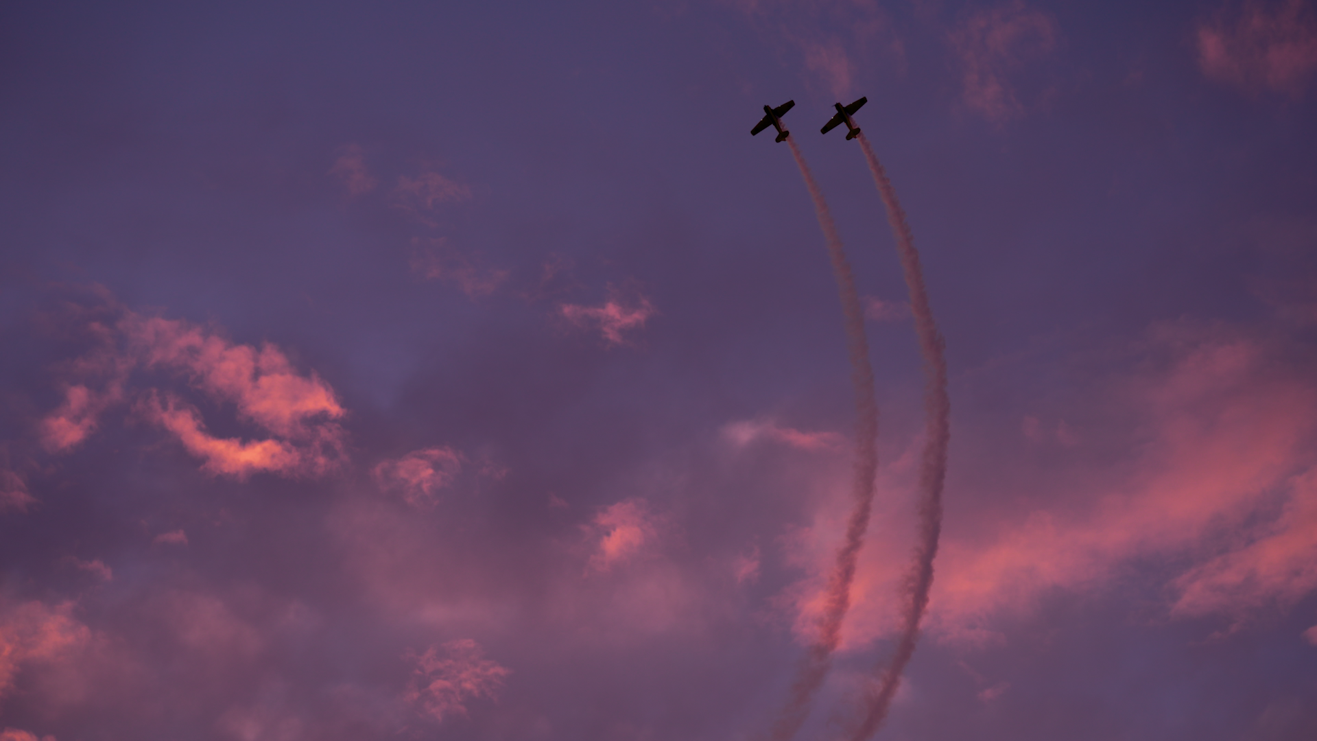 In this still taken from video, two airplanes from the Erickson Aircraft Collection perform at the Airshow of the Cascades in Madras, Ore., on Aug. 23, 2024.