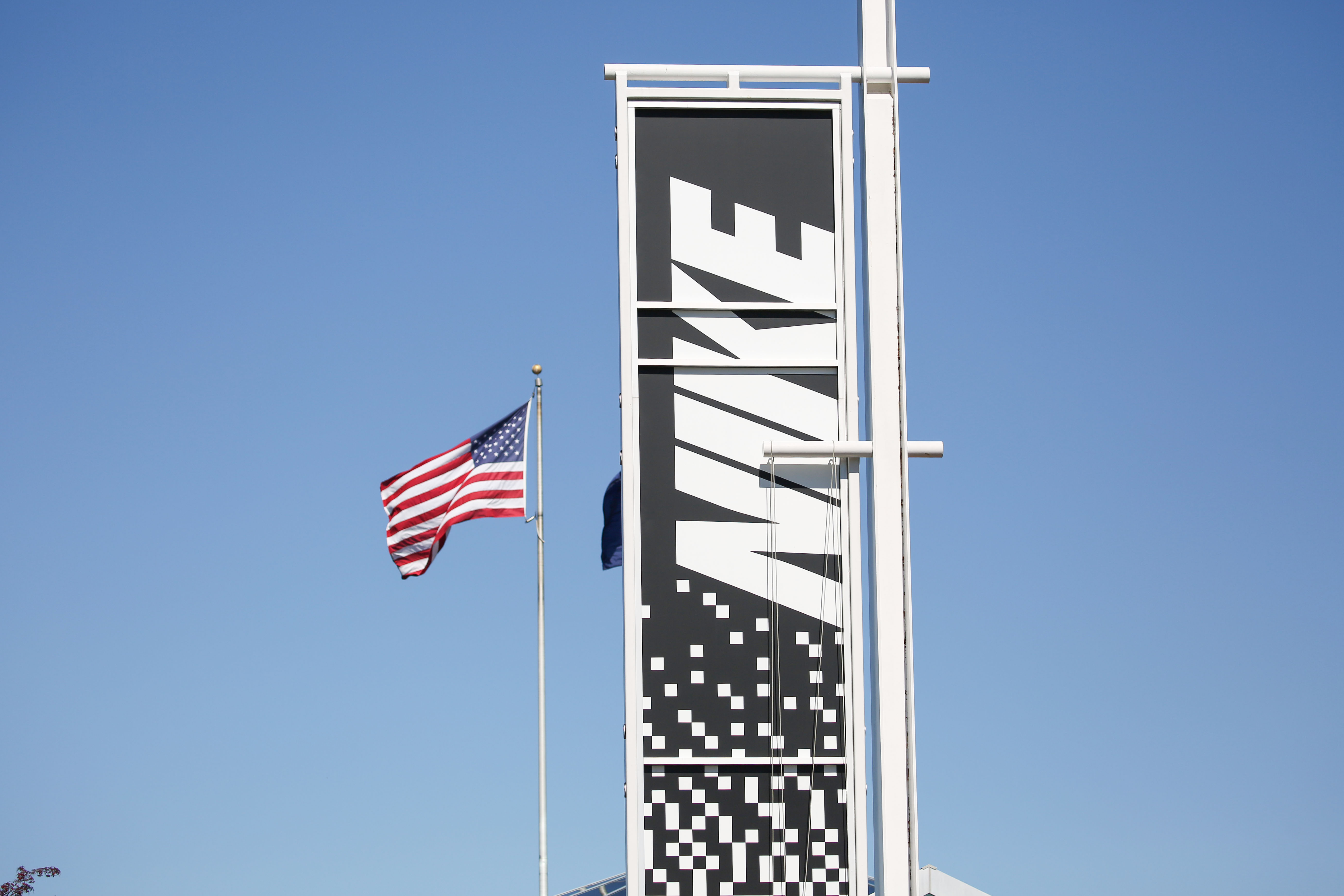 An American flag flies above the Nike Headquarters near Beaverton, Ore., June 30, 2025. Nike’s Washington County campus is considered to be the company’s global headquarters, containing over 75 buildings on more than 286 acres.