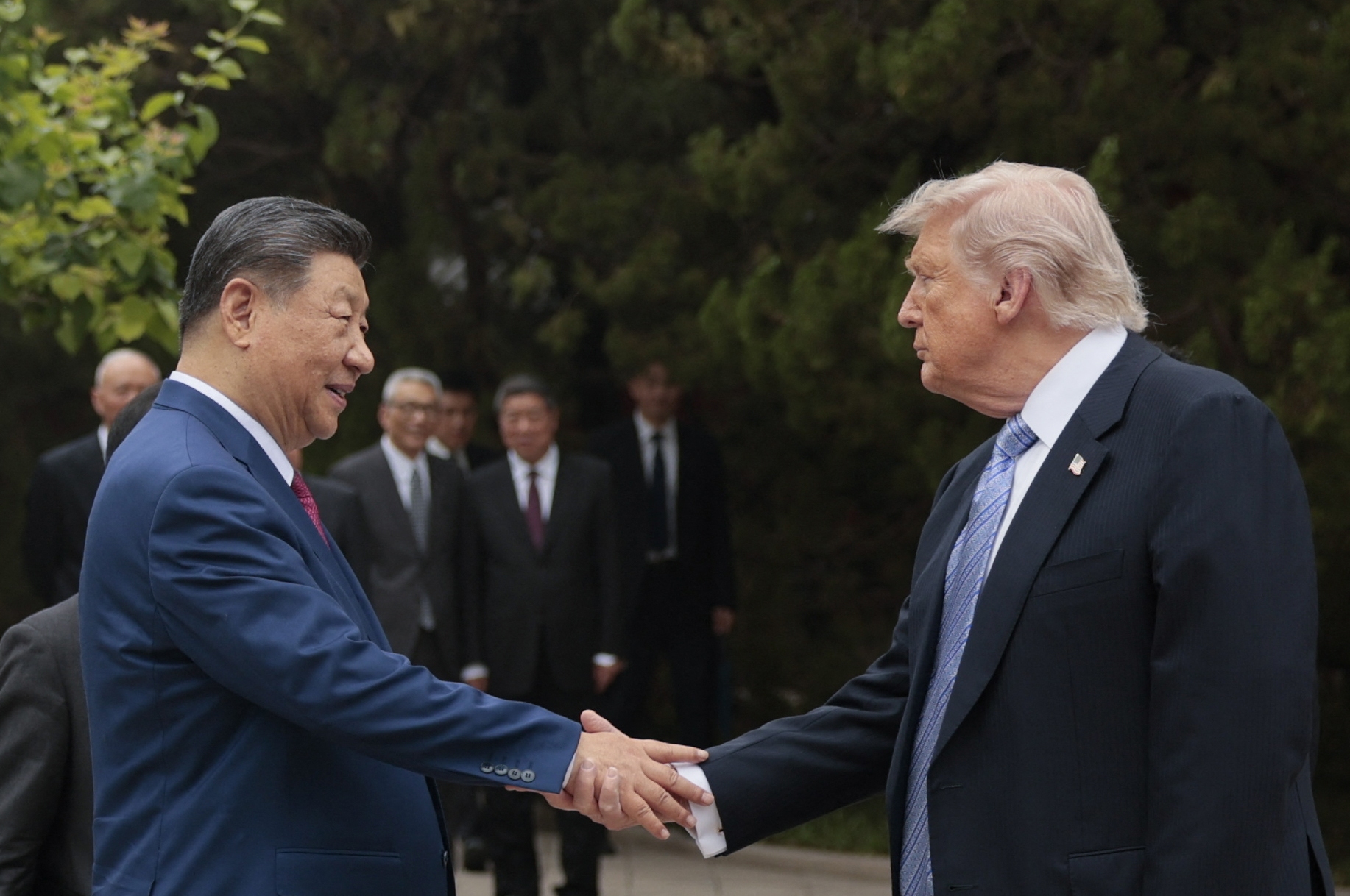 President Trump shakes hands with China's President Xi Jinping as he leaves after a visit to Zhongnanhai Garden in Beijing on May 15.