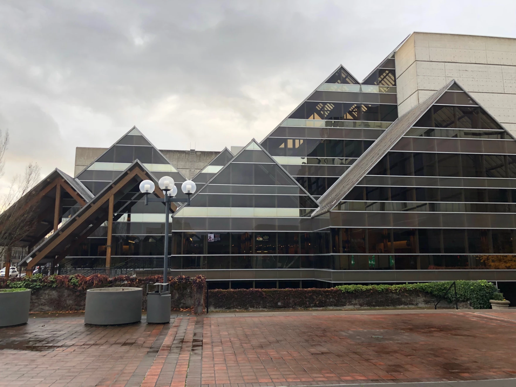 The exterior of the Hult Center in Eugene. It is an arts venue that looks like multiple glass pyramids.