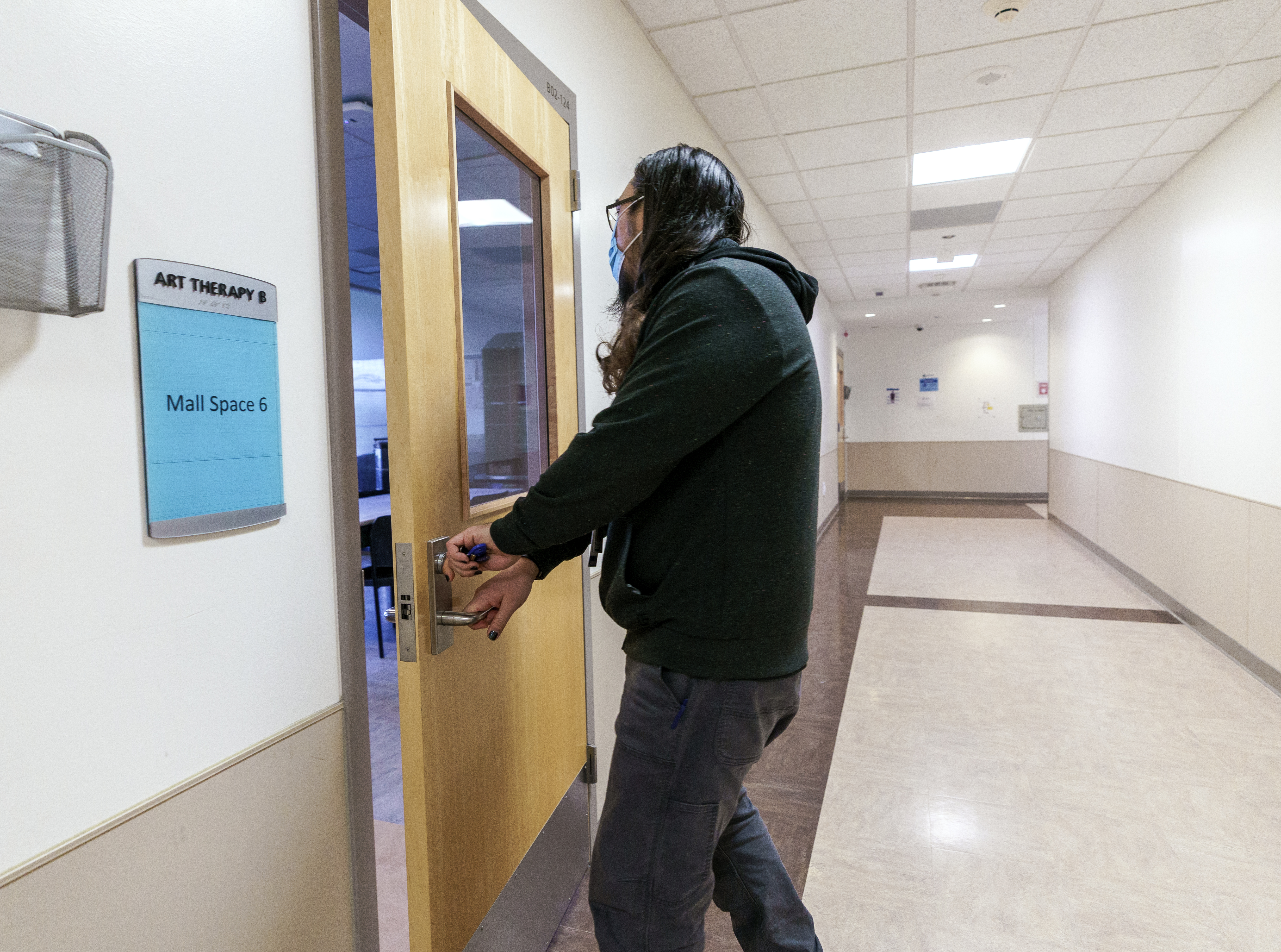 FILE - An employee opens a door to the art therapy room at the Oregon State Hospital in Salem, March 8, 2023.