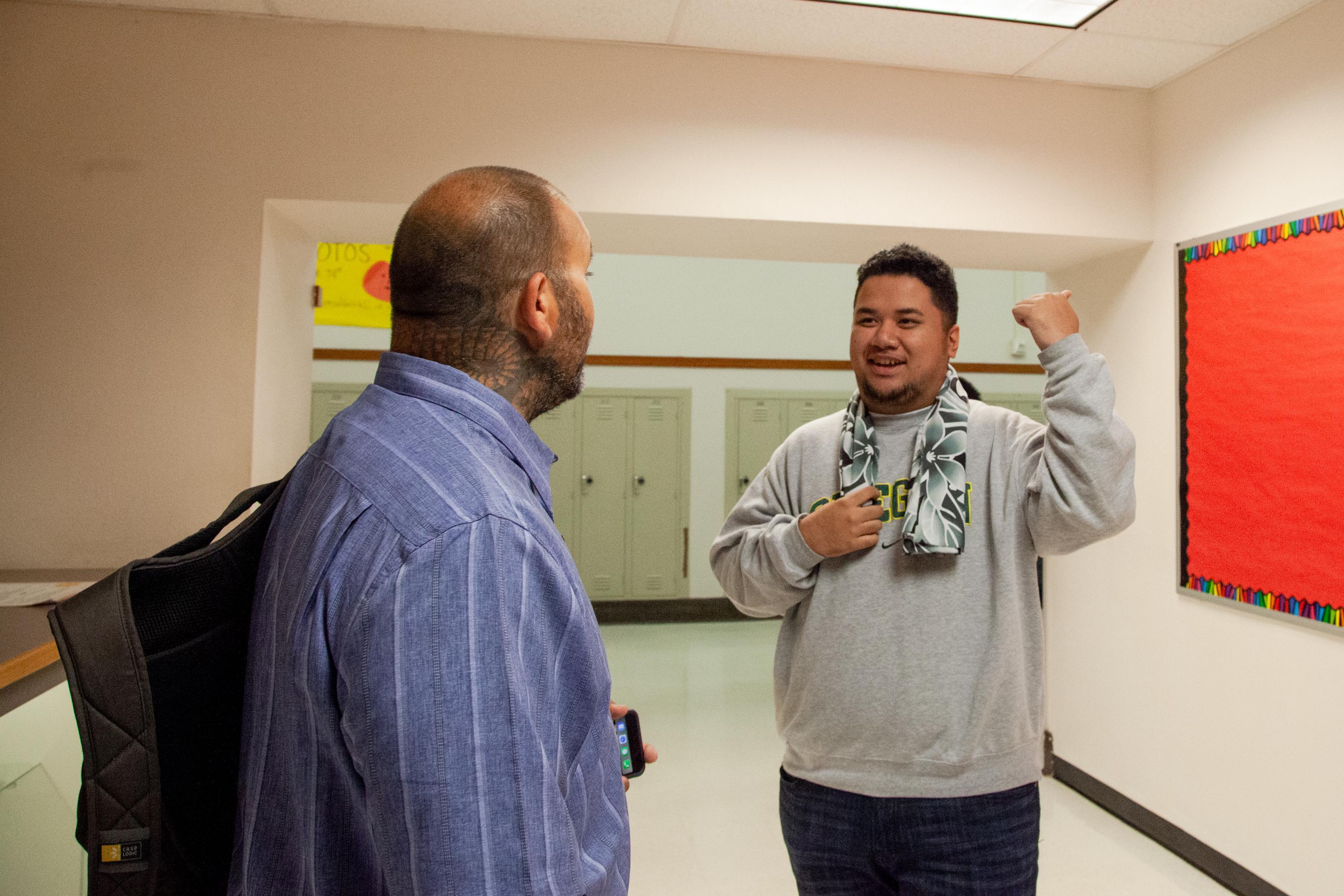 Ken Ramirez greets Dale, a senior, at North Salem High School in Salem, Ore., Tuesday, Sept. 17, 2019. Community resource specialists like Ramirez help student groups achieve academic success with one-on-one support.