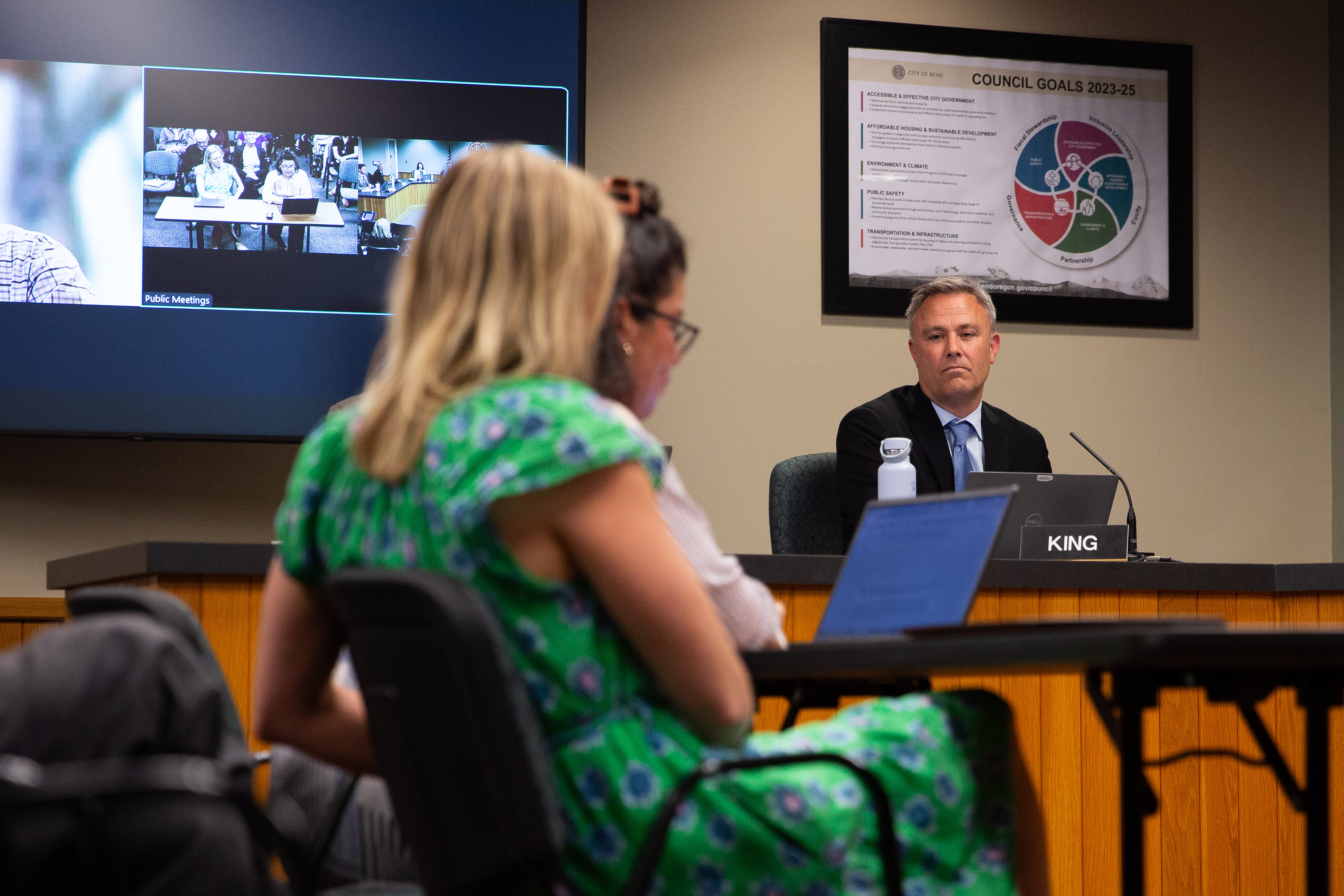 City Manager Eric King (right) listens as Human Rights and Equity Commission members give public comment during a City Council meeting on Aug. 6, 2025 in Bend, Ore. Chair Agatha Ventura requested a meeting with City Council and the Human Rights and Equity Commission to discuss the delay in payment to an organizer for a Juneteenth event.
