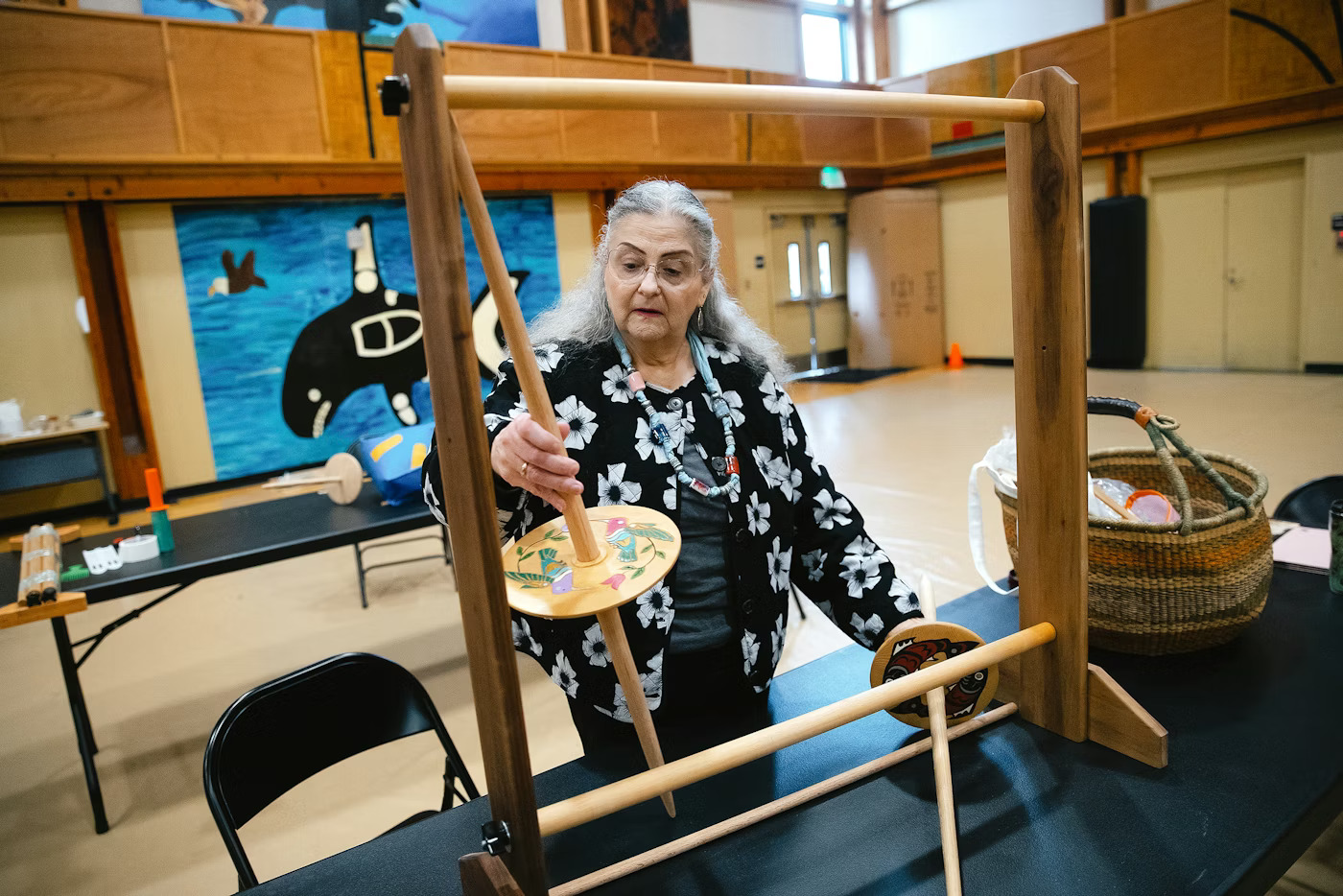 Sue Dixon sets up her loom before a weaving class with instructor Susan Pavel, with the Coast Salish Wool Weaving Center, on Saturday, March 7, 2026, at the Don Hatch Youth Center in Tulalip.