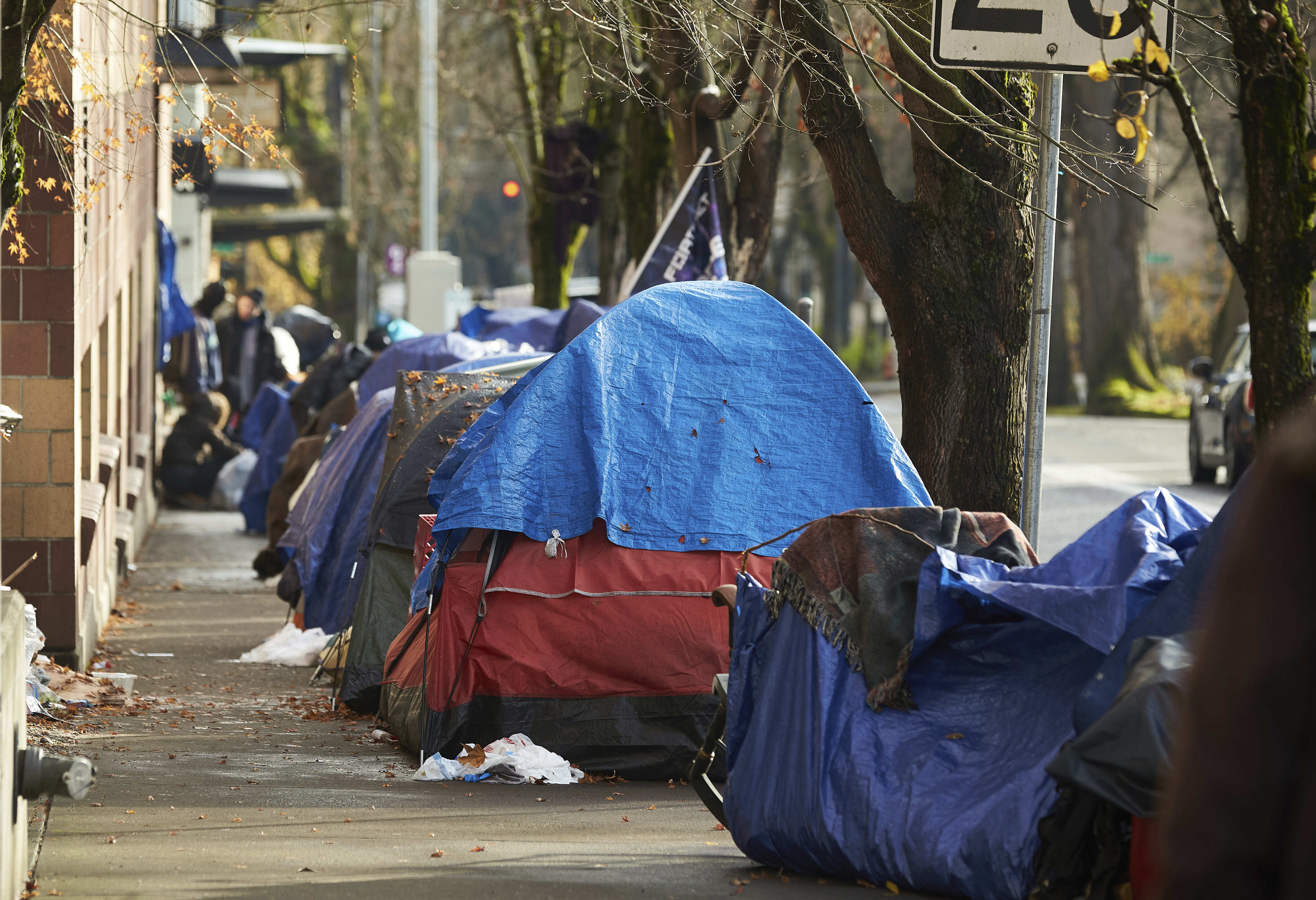 FILE: There were 582,462 people sleeping on the streets of the U.S. during a single night in January this year, according to the U.S. Department of Housing and Urban Development — a 0.3% increase since 2020.