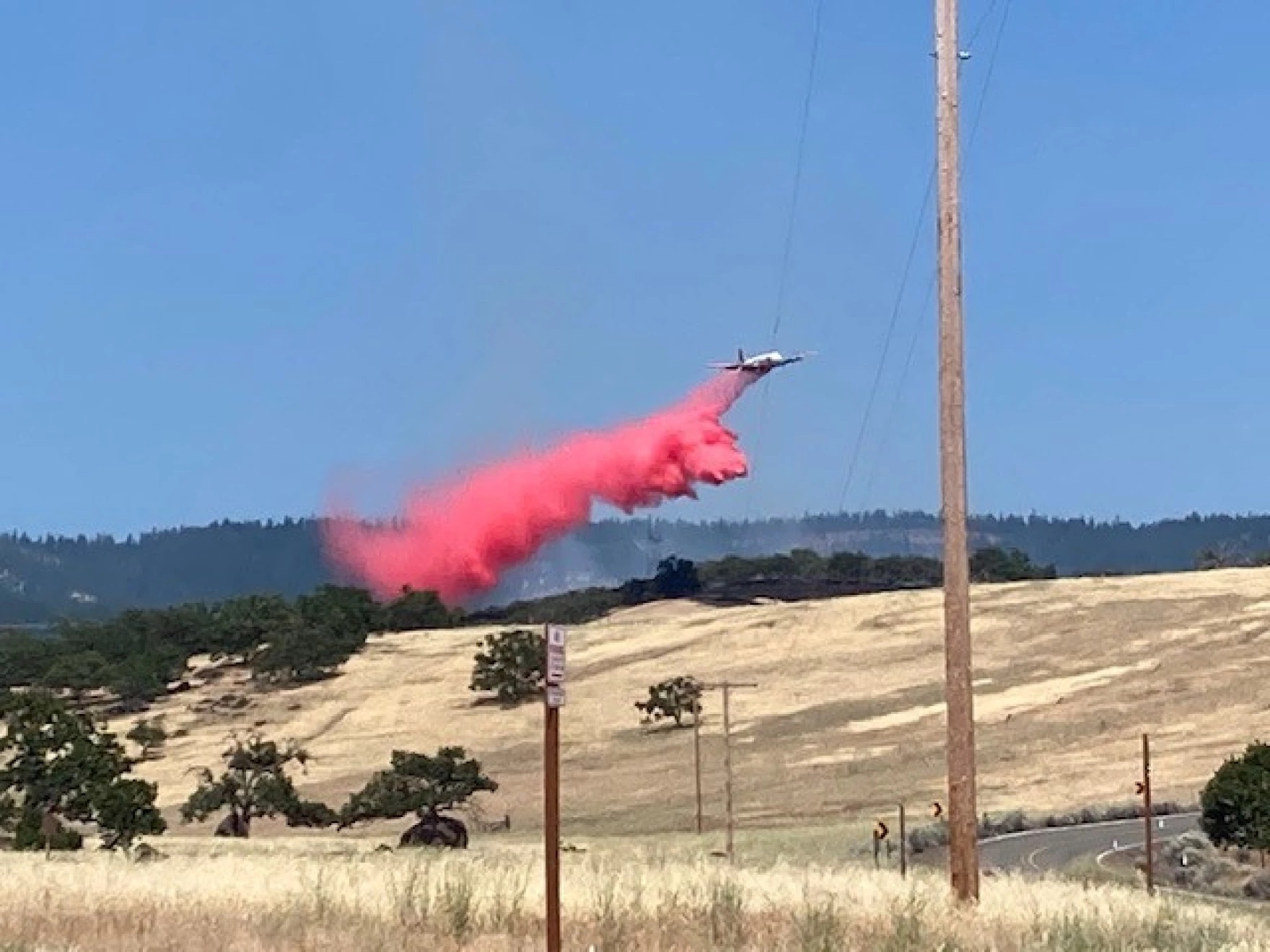 An aircraft drops retardant on a fire in ODF's Southwest Oregon District in 2020.