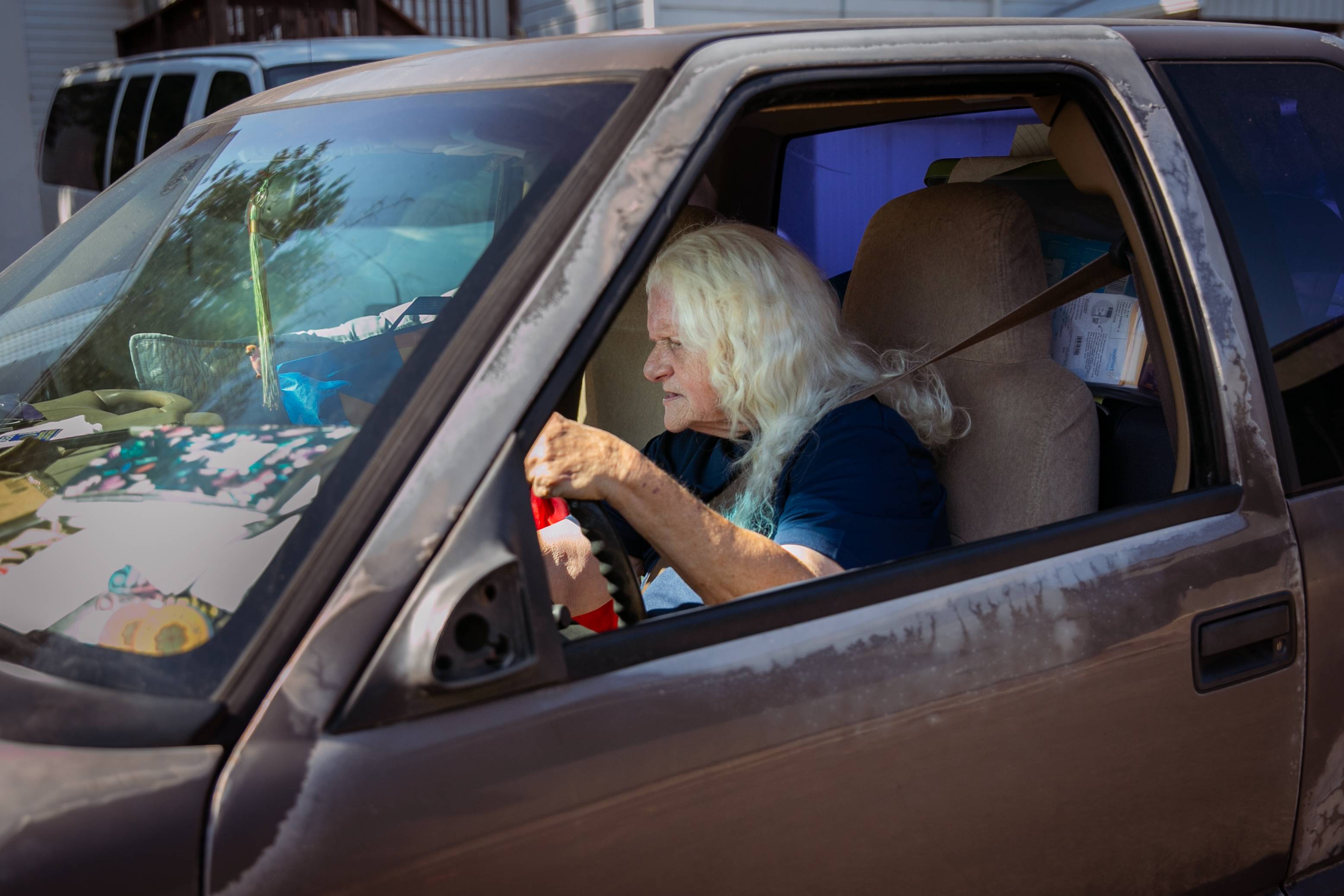 Gallagher leaves the parking lot of the Safe Showers program in Monmouth. Gallagher has been sleeping in the two front seats of her pickup truck since January.