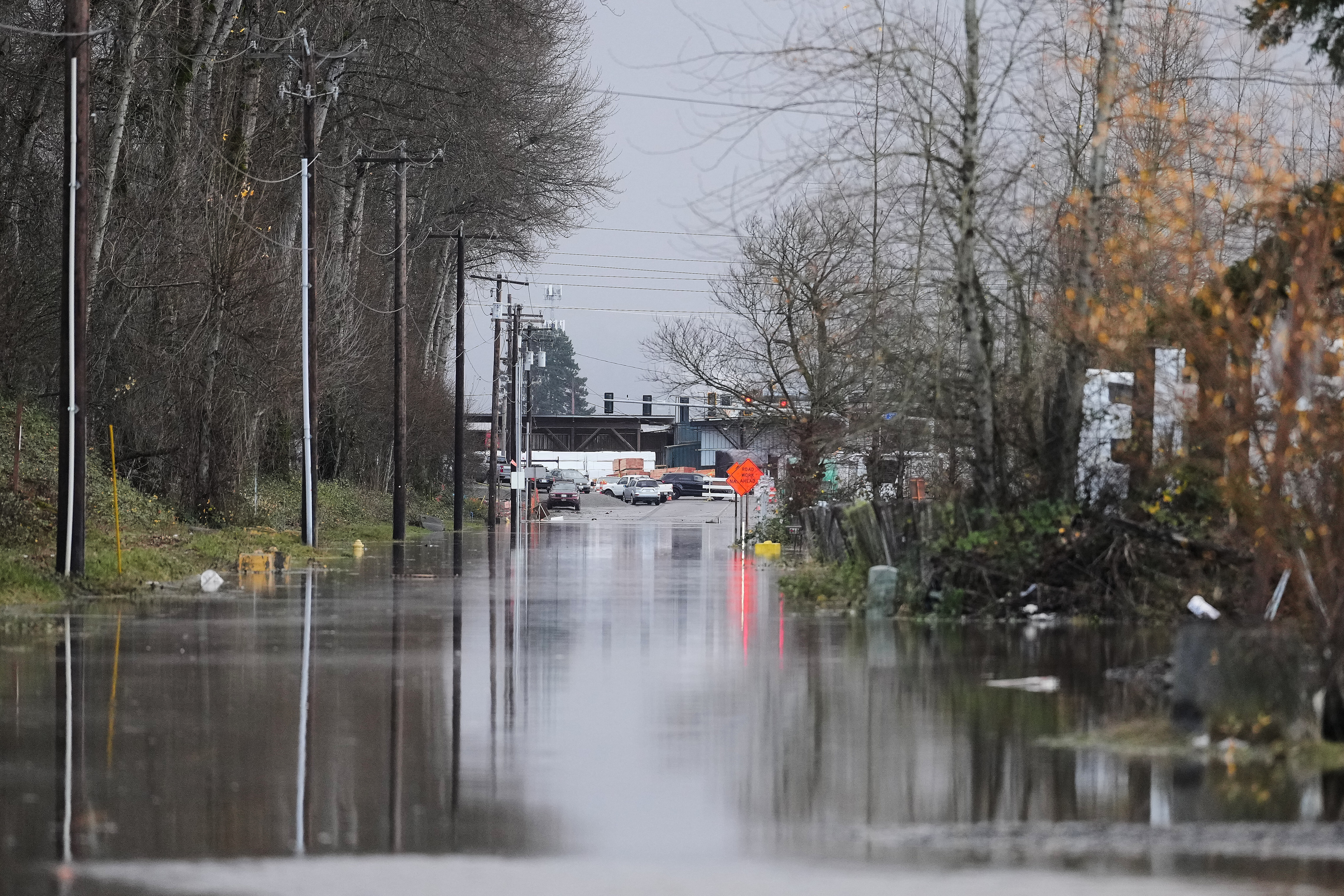 FiLE - A road remains submerged in water after heavy rains and a levee failure caused flooding Wednesday, Dec. 17, 2025, in Pacific, Wash.