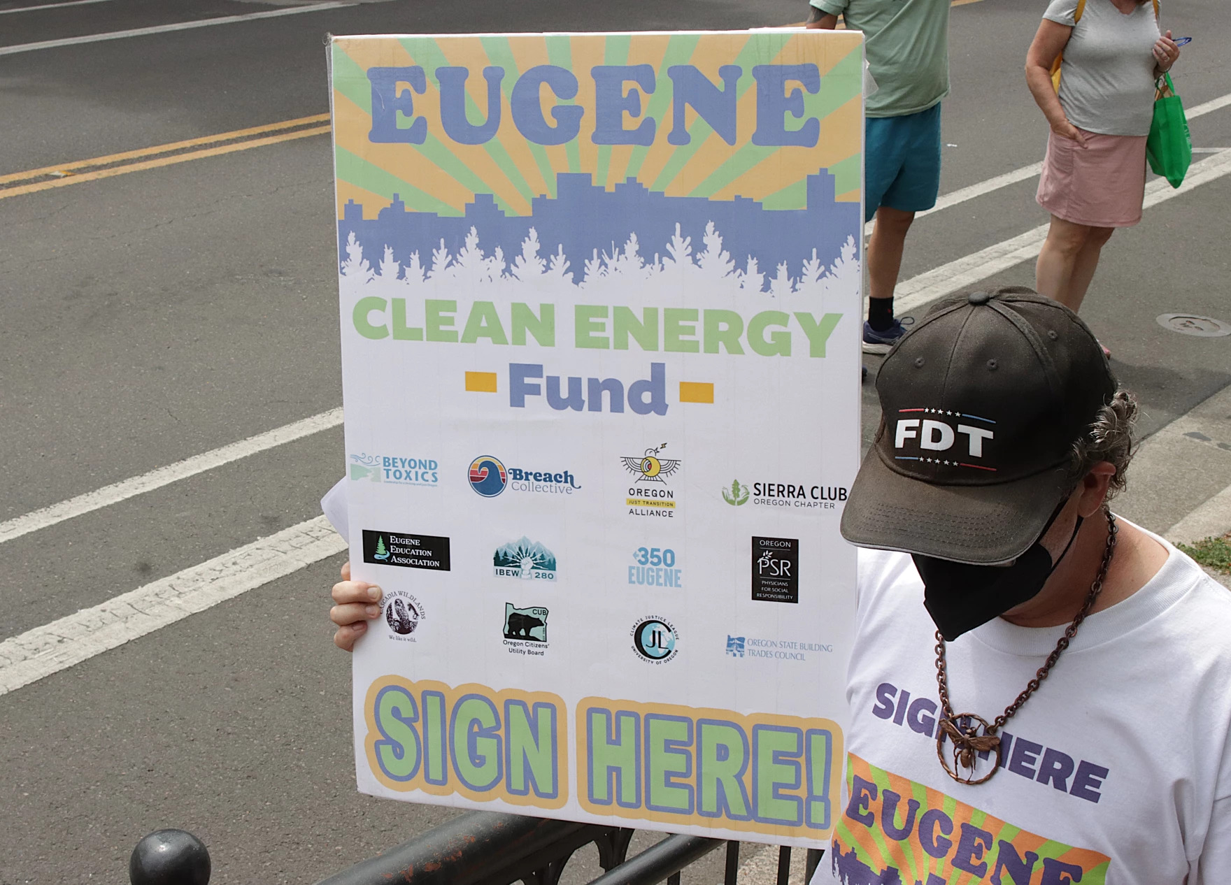 Eugene Clean Energy Fund supporters march through downtown Eugene, July 21, 2026.