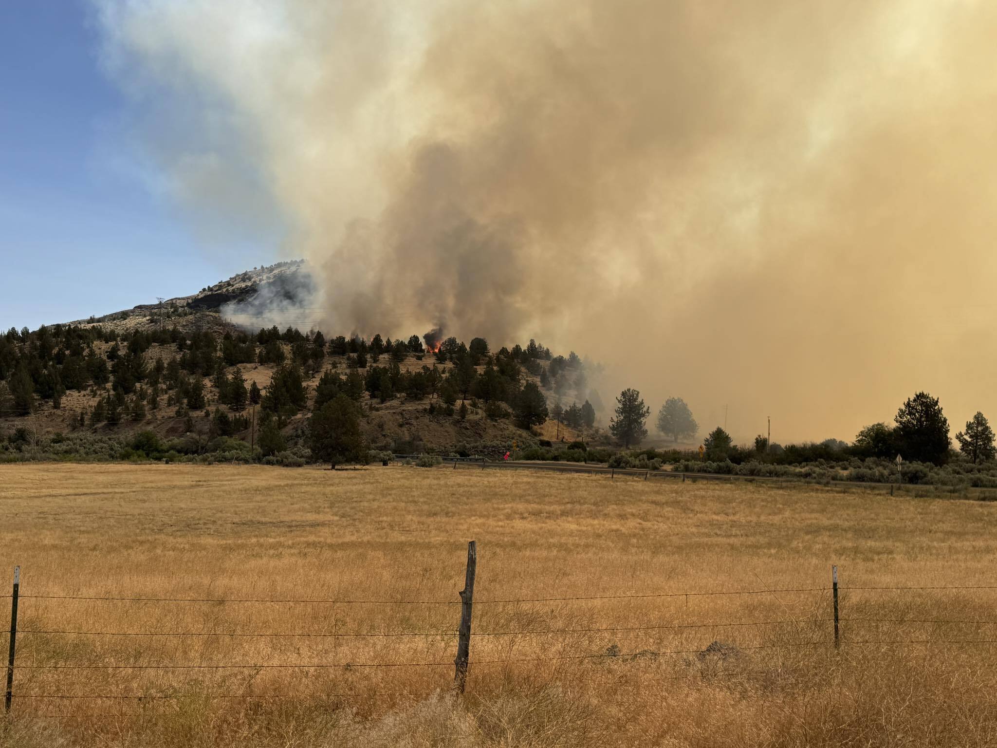 In a photo provided by the Wasco County Sheriffs Department, the Cram Fire burns a hillside. The Cram Fire started on July 13, 2025 in Jefferson county, near the Wasco county border.