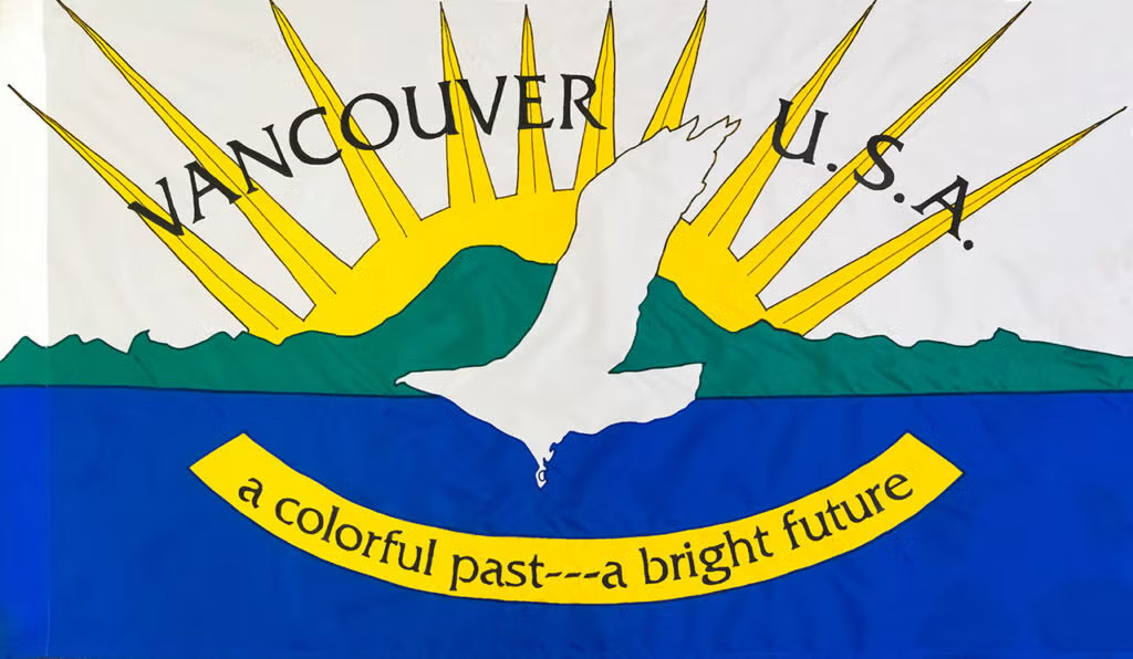 The current city flag of Vancouver, Wash., features a white bird flying over a river and mountains under a rising sun.