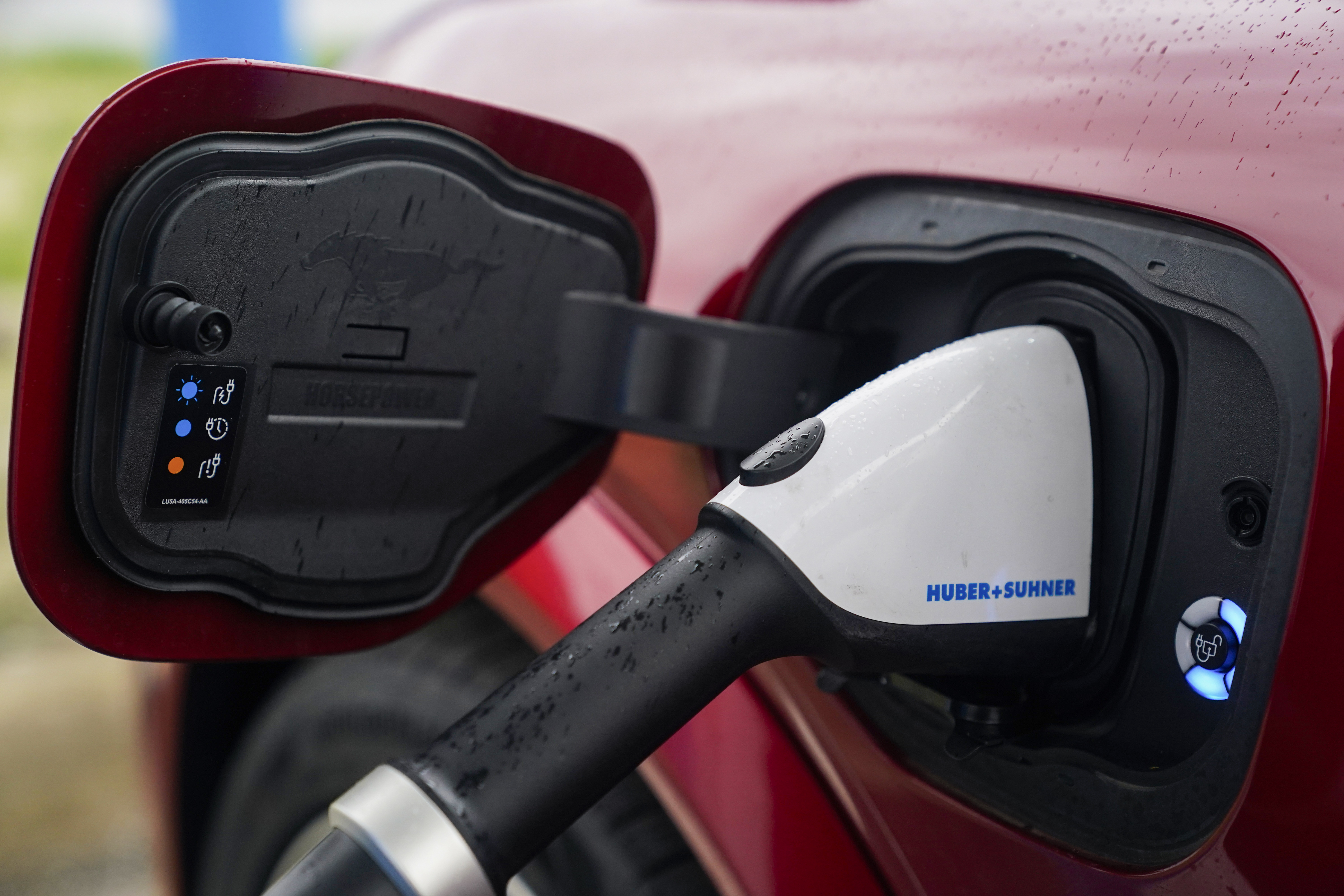 FILE - A 2023 Ford Mustang Mach-E charges, March 8, 2024, at an electric vehicle charging station in London, Ohio.