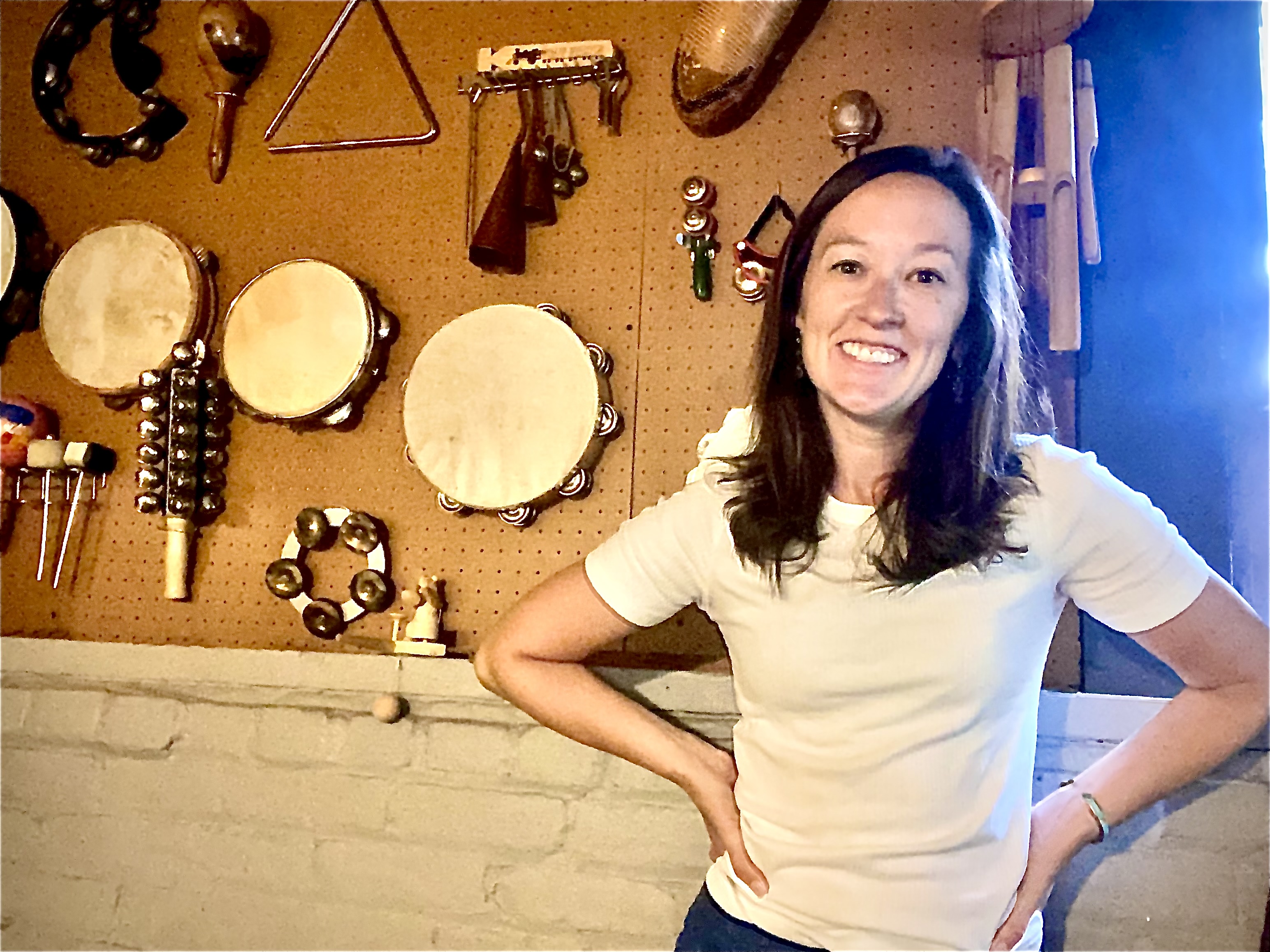 Host and drummer Meg Samples stands in her home studio for a photo.