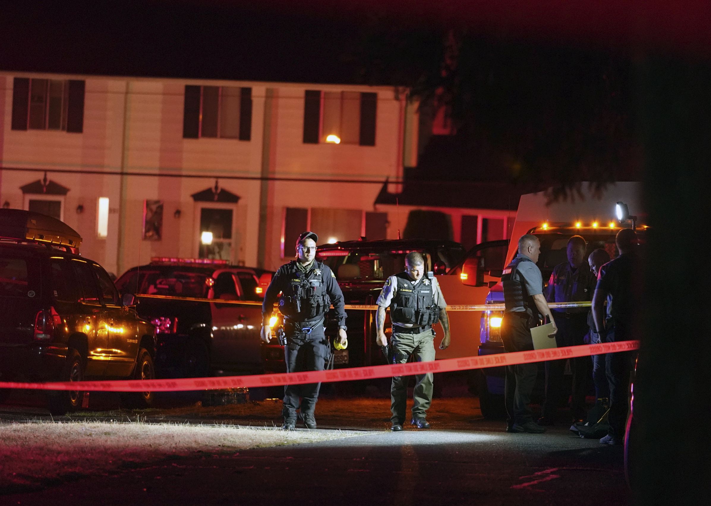 Police officials work at a scene where a man suspected of fatally shooting a supporter of a right-wing group in Portland, Ore., last week was killed as investigators moved in to arrest him in Lacey, Wash., Thursday, Sept. 3, 2020. Michael Reinoehl, 48, was killed as a federal task force attempted to apprehend him in Lacey, a senior Justice Department official said. Reinoehl was the prime suspect in the killing of 39-year-old Aaron “Jay” Danielson, who was shot in the chest Saturday night, the official said.