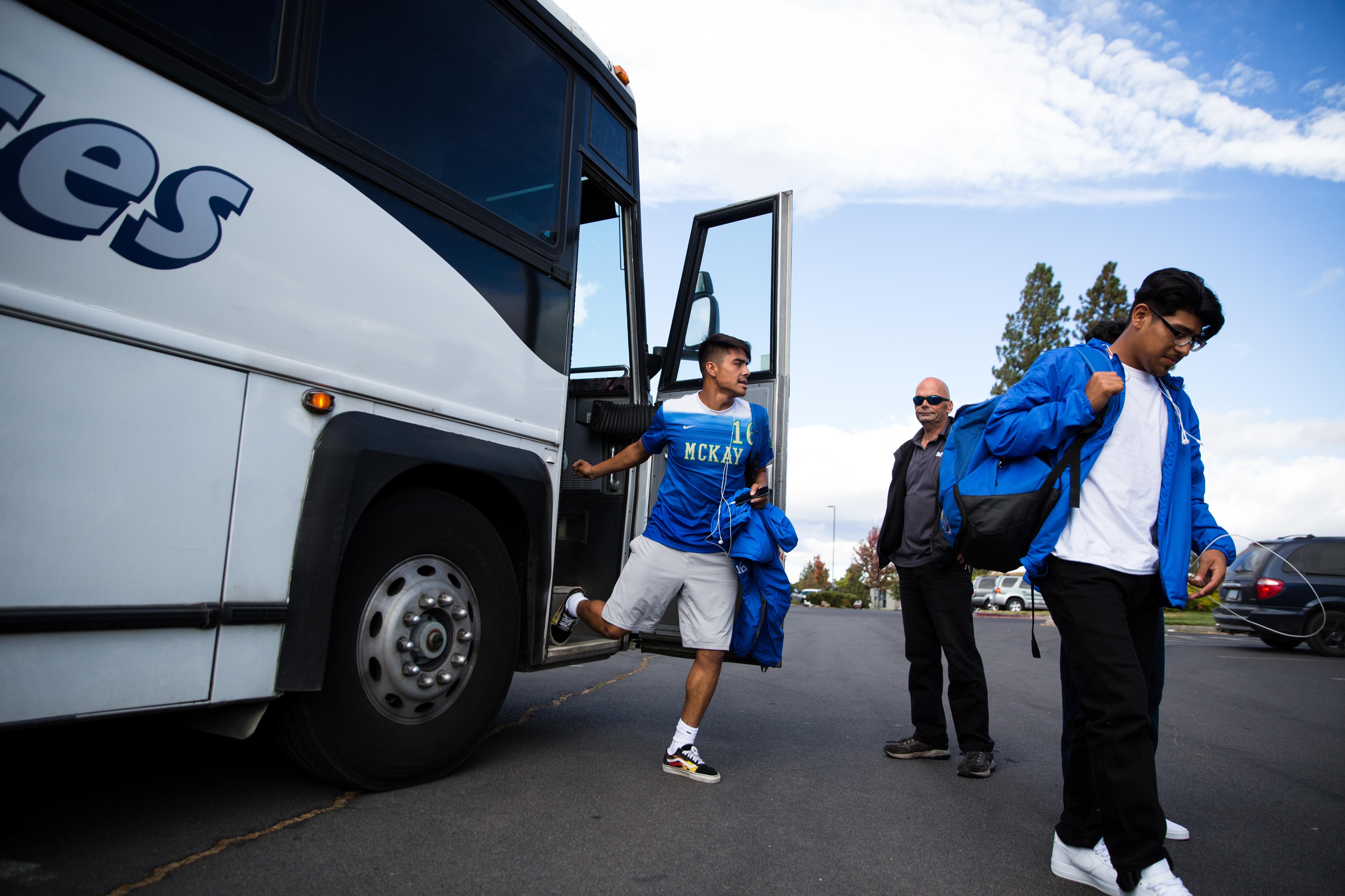 Luis Cuellar gets off the bus at Summit High School in Bend. The trip from Salem to Bend takes about three hours in good weather.