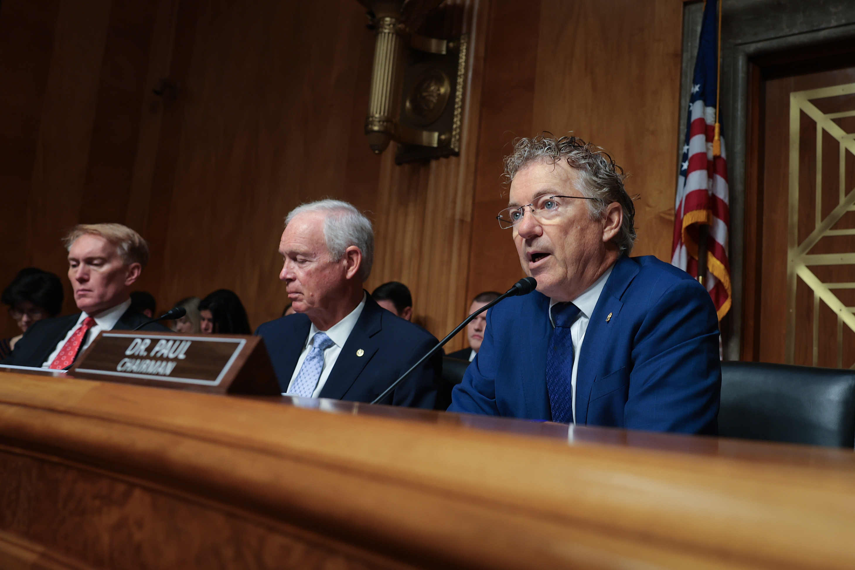 Sen. Rand Paul sits in front of a microphone as he delivers his opening statement at a Senate Homeland Security and Governmental Affairs Committee hearing on July 29.