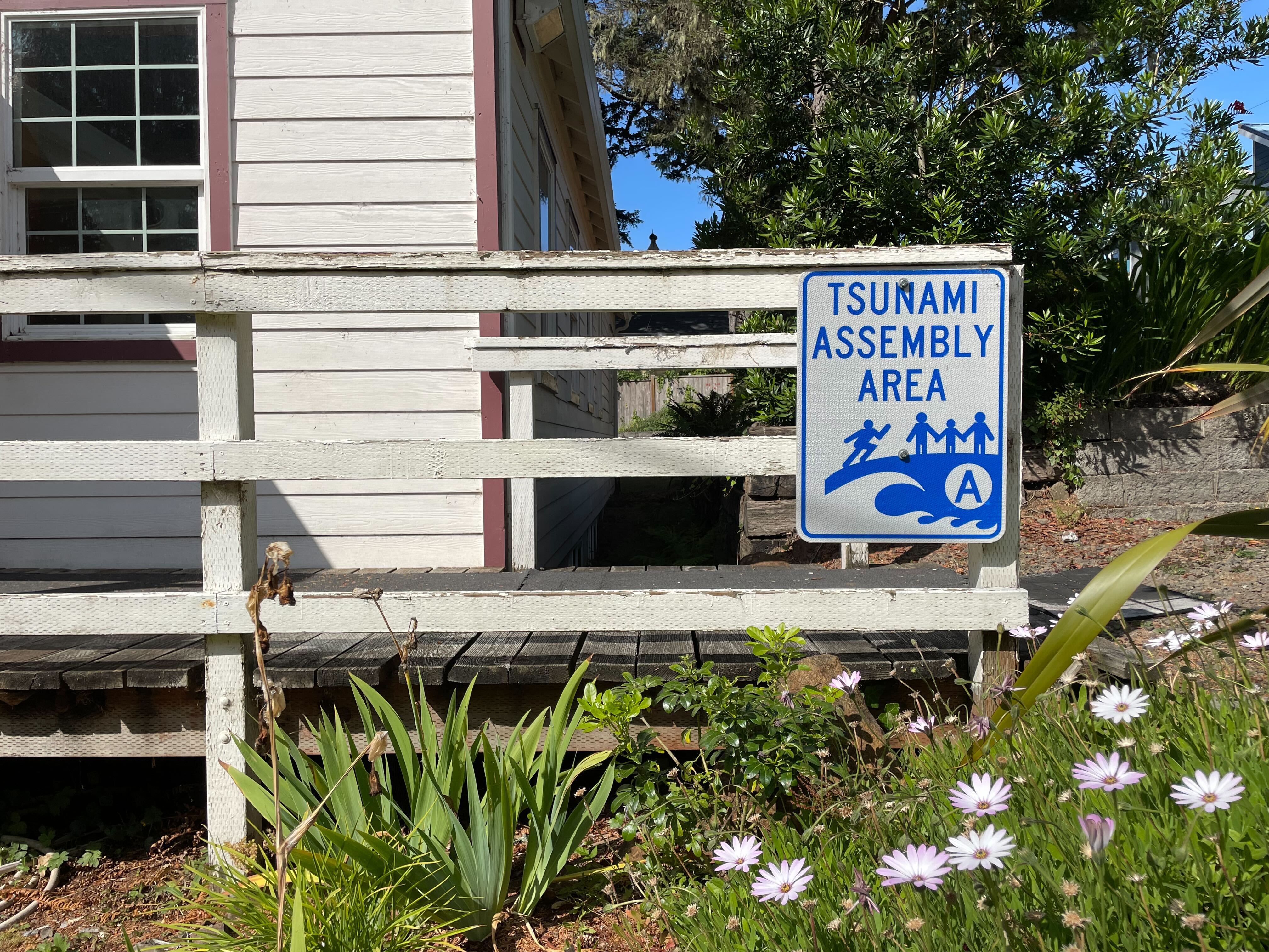 FILE - A tsunami assembly area sign in Oceanside, Ore., on July 30, 2025.