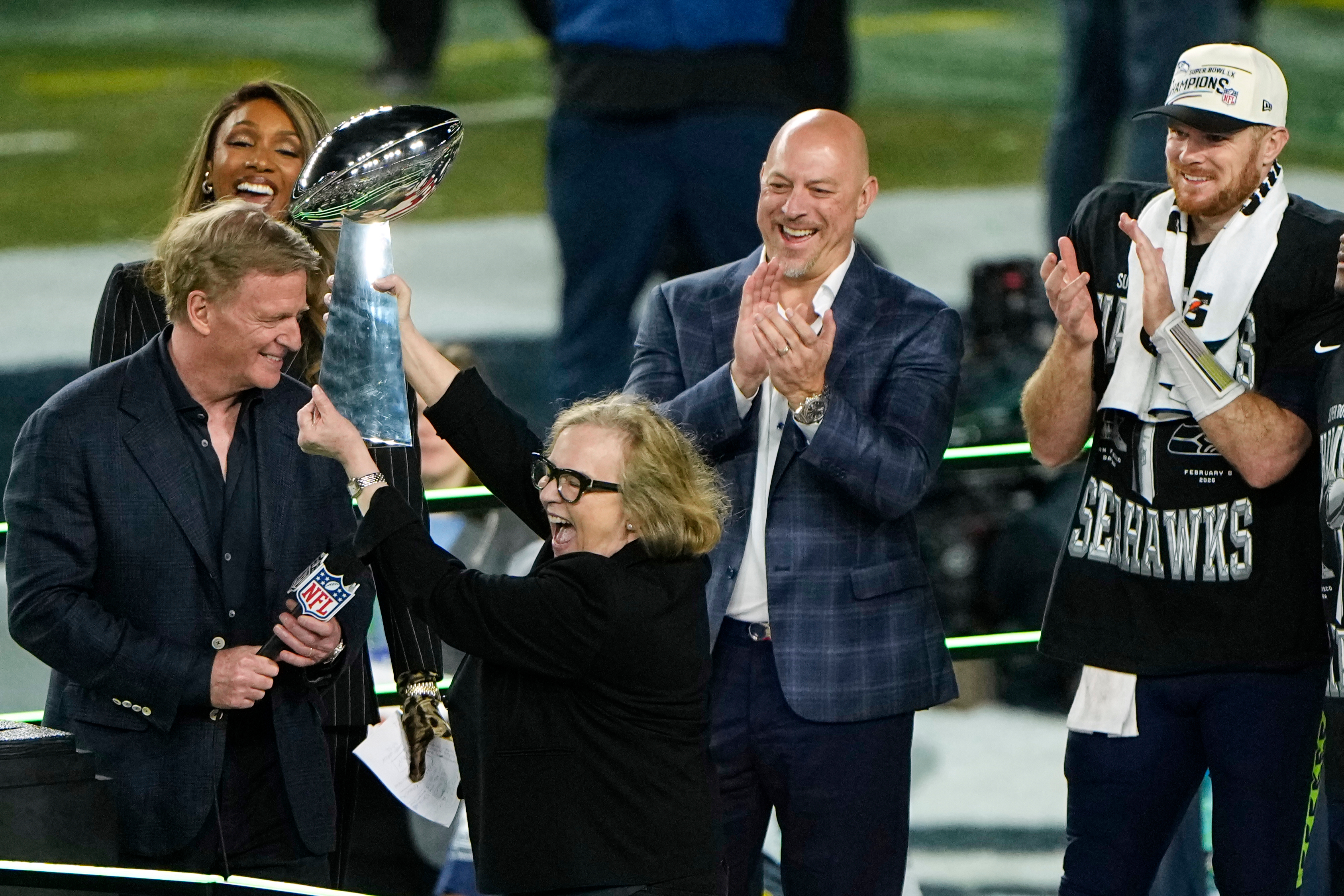 FILE - Seattle Seahawks chair Jody Allen, second from left, celebrates with the trophy after the team's Super Bowl win over the New England Patriots, Feb. 8, 2026, in Santa Clara, Calif.